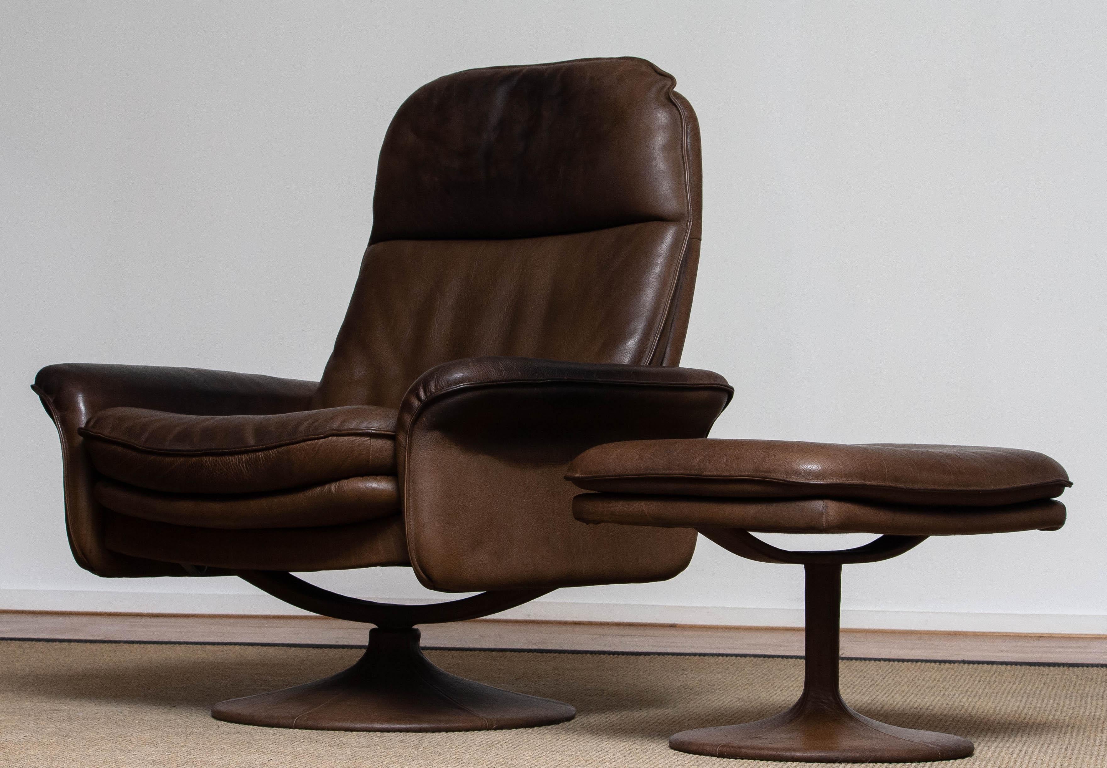 Swiss 1970's Buffalo Leather Swivel and Relax Chair with Matching Ottoman by De Sede