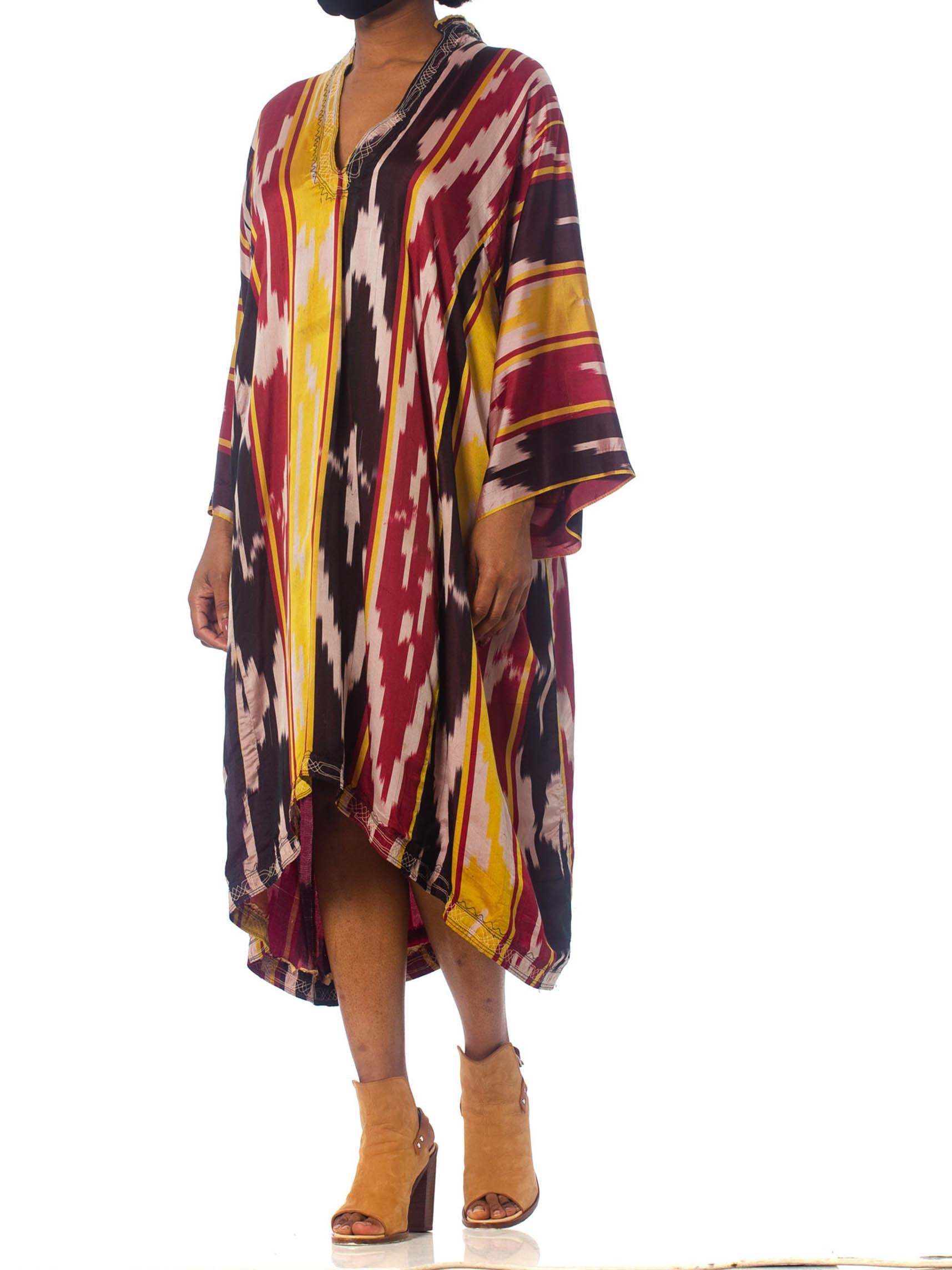 Brown 1970S Burgundy & Gold Silk Ikat Long Sleeve Unisex Kaftan With Pleated And Embr For Sale