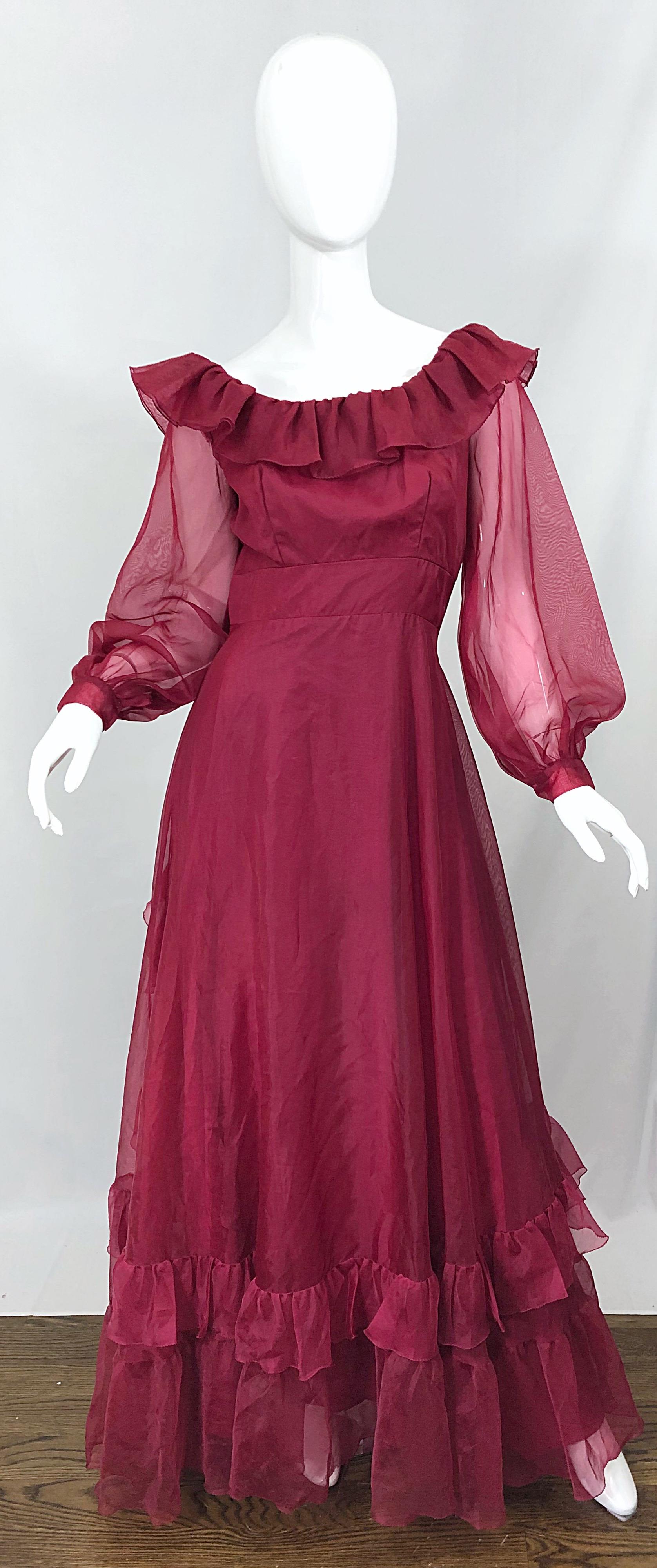 Fantastic mid 1970s burgundy ruffle maxi dress! Features intricate ruffle details on the front and back. Hidden metal zipper up the back with hook-and-eye closure. Great with sandals or wedges for a day event, or heels for evening. In great