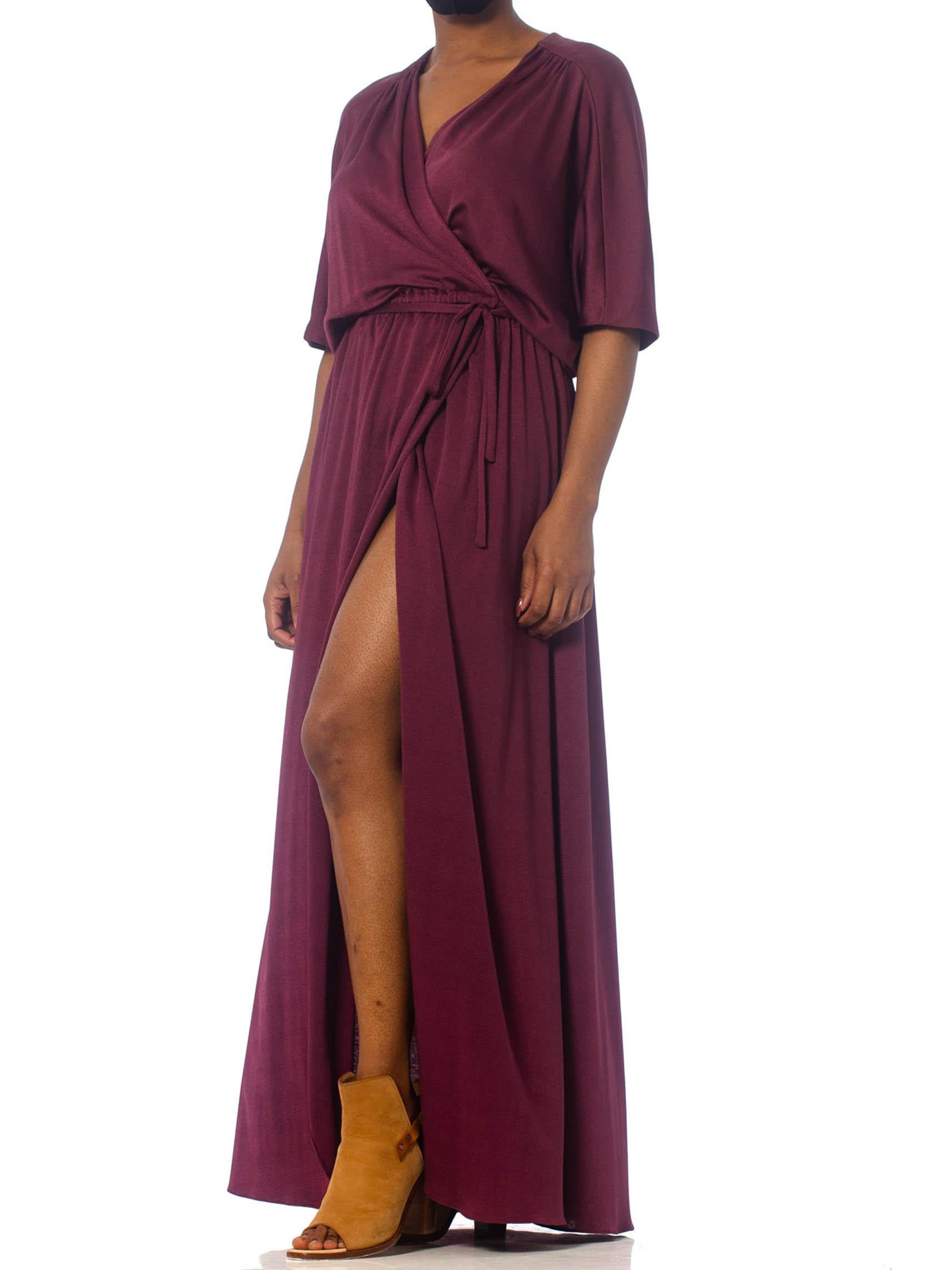 Elastic in the waist as well as the wrap design really lets this gown fit a lot of sizes. Better fit on a medium to XL size.  1970S Burgundy Polyester Jersey Maxi Wrap Dress With Sheer Lace Back 