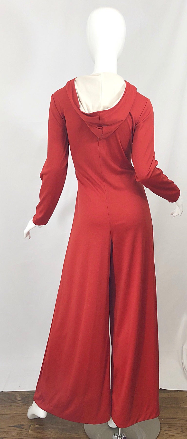 1970s Burnt Orange Hooded Jersey One Piece Wide Flare Leg Vintage 70s Jumpsuit For Sale At 1stdibs Flared Jumpsuit 70s Flare Jumpsuit 70s 70s Orange Jumpsuit