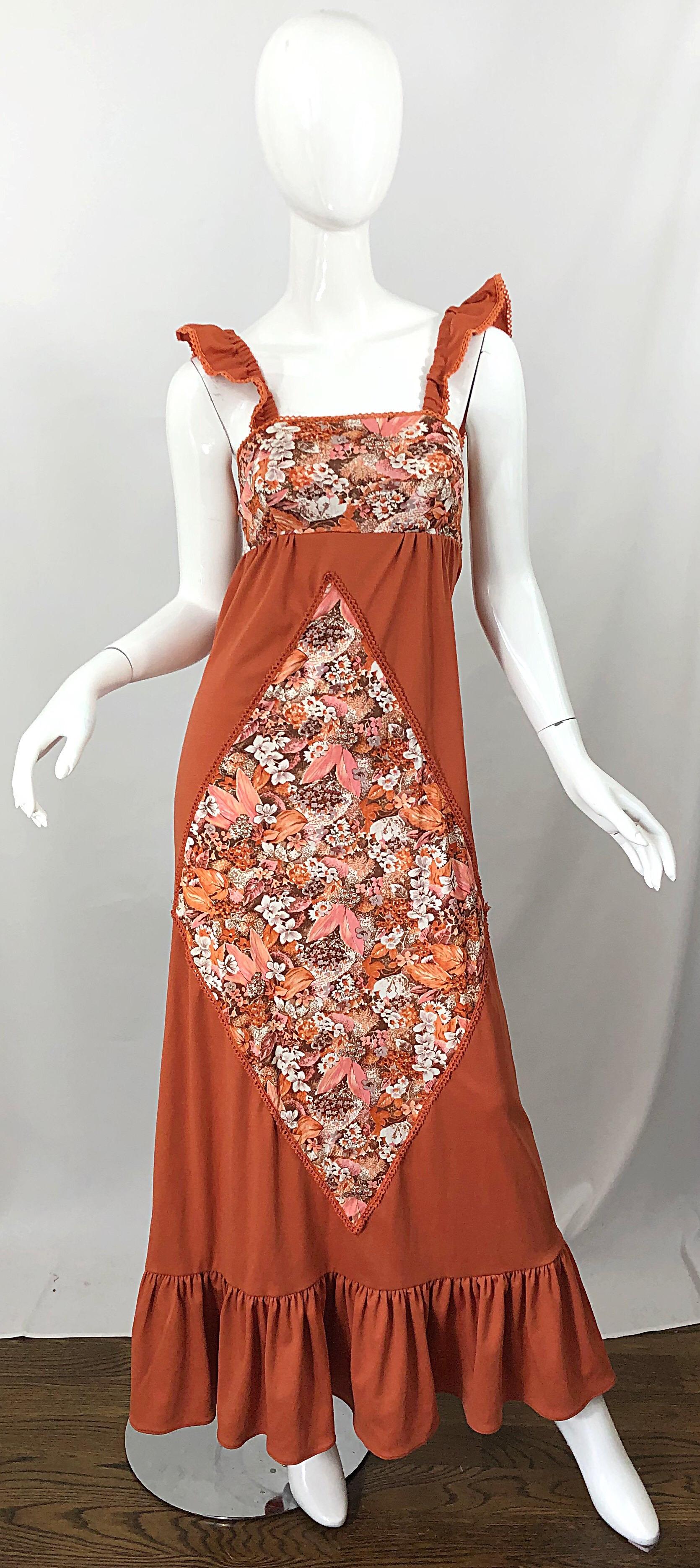 Amazing 1970s burnt orange patchwork flowers and leaves jersey maxi dress! Features a rich autumn burnt orange base color. Diamond shaped patchwork on the front with flowers and leaves printed in warm hues of pink, ivory, brown and orange. Same