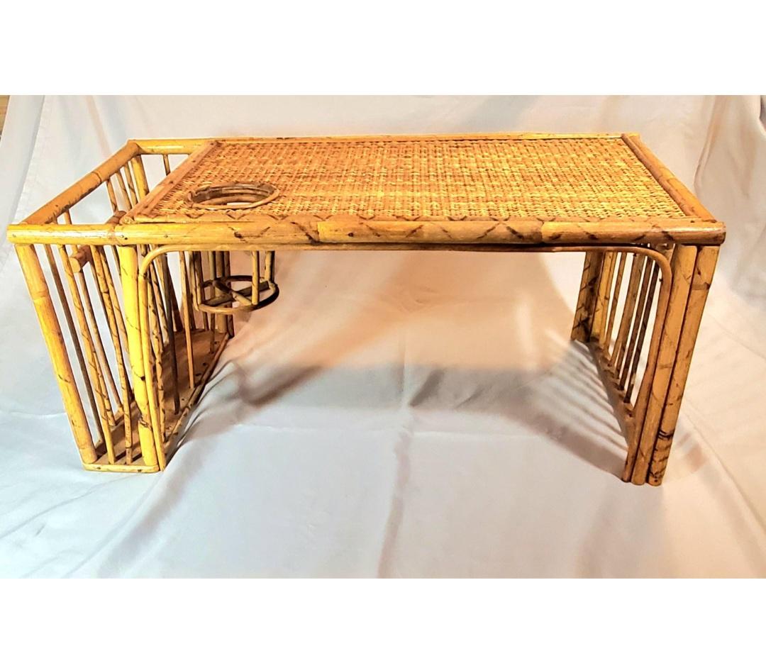 Breakfast in bed never looked so good! A gorgeous burnt bamboo or tiger bamboo bed tray with a magazine cubby and cup holder. Created from pieces of bamboo, this tray has tall legs on each side. One side features a cubby for holding magazines or