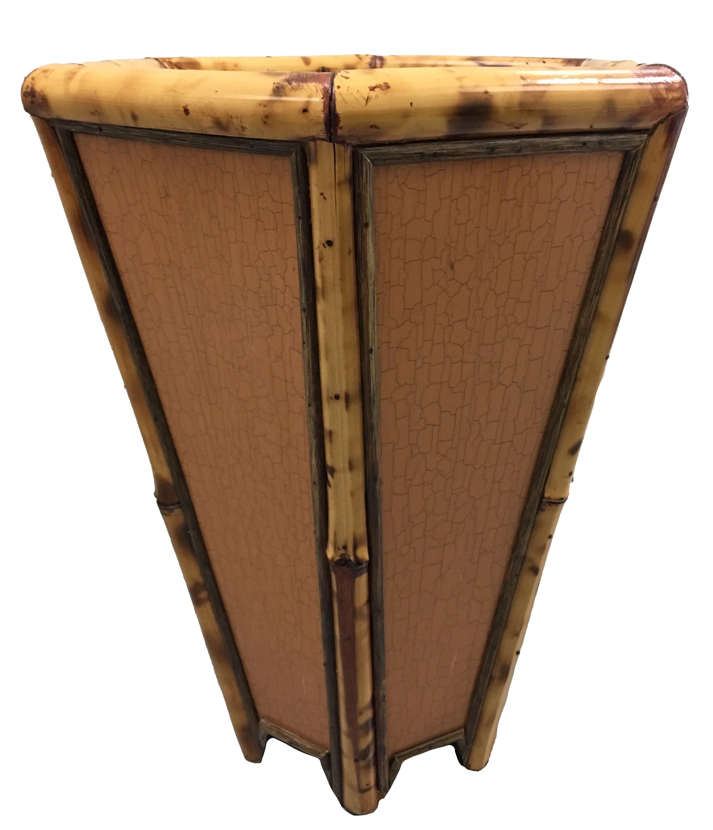 1970s burnt bamboo hexagonal umbrella stand. Very solid heavy design. Six panels with crackle finish trimmed with bamboo. Interior is black lacquer wood with all over design. No makers mark.