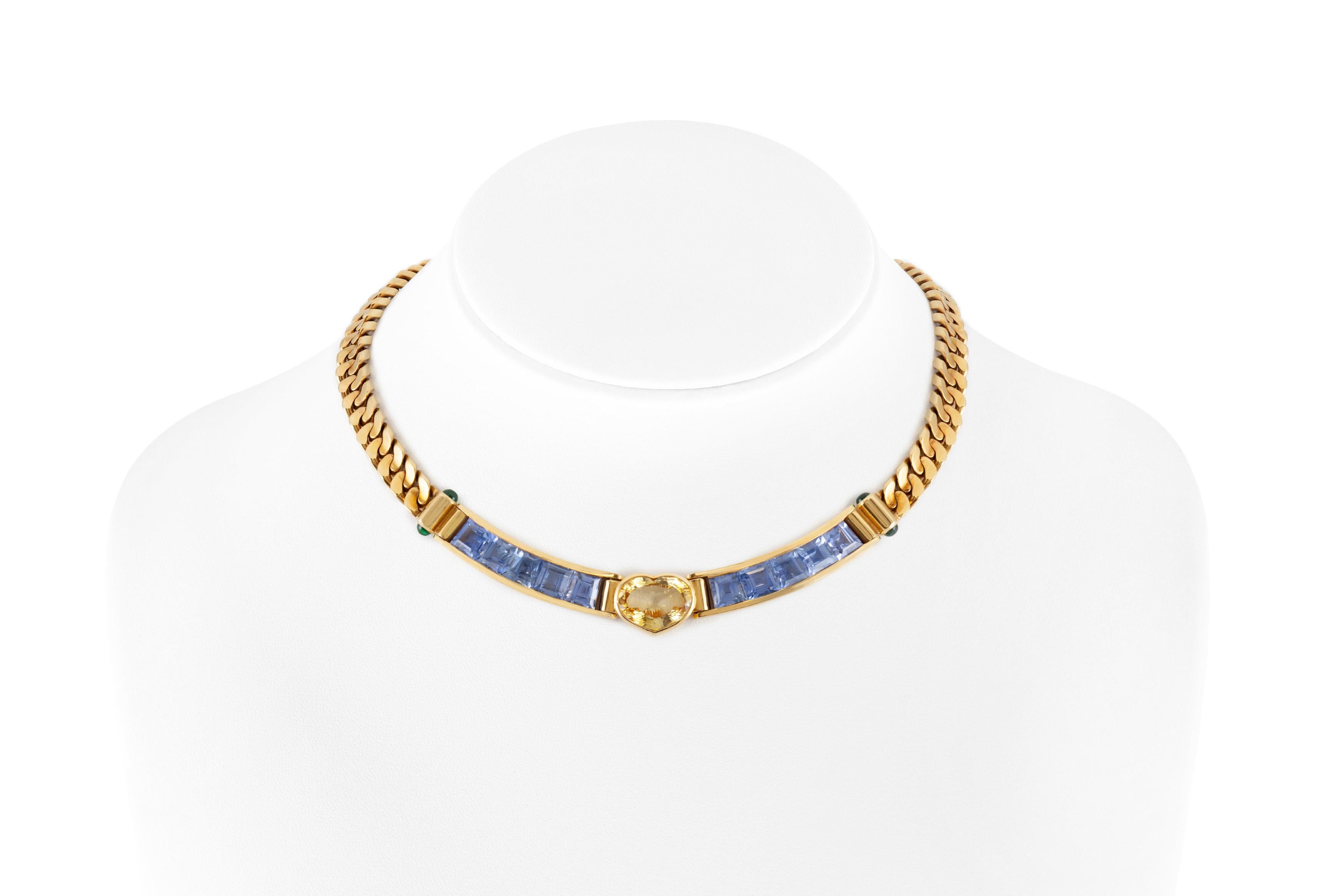 The necklace is finely crafted in 18k yellow gold with a heart cut yellow sapphire weighing 9.23 carats, and blue sapphires weighing a total of 19.58 carats.
Earrings are finely crafted in 18k yellow gold with 4 yellow heart sapphires weighing a