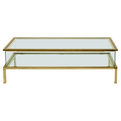 1970s by Maison Jansen Hollywood Regency Sliding Design Brass Coffee Table