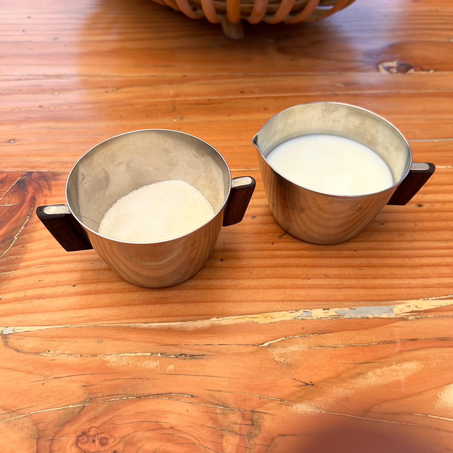 Mid-Century Modern 1970s by MCH Stainless Sugar & Creamer Set Exotic Wood Handle Denmark For Sale