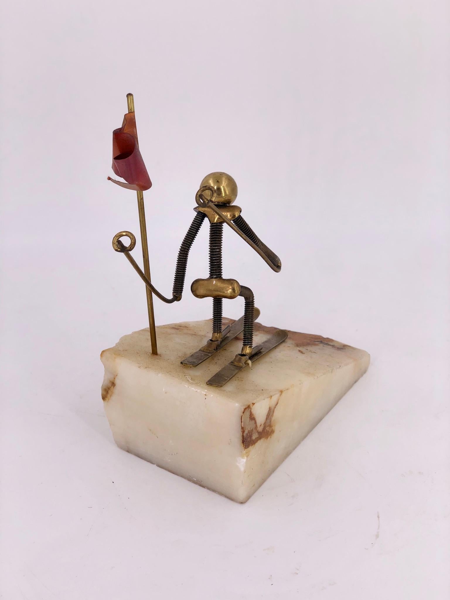 Whimsical sculpture in brass, copper and Onyx, hand-fashioned with steel parts mounted on solid onyx circa 1970s comes with its certificate tag.