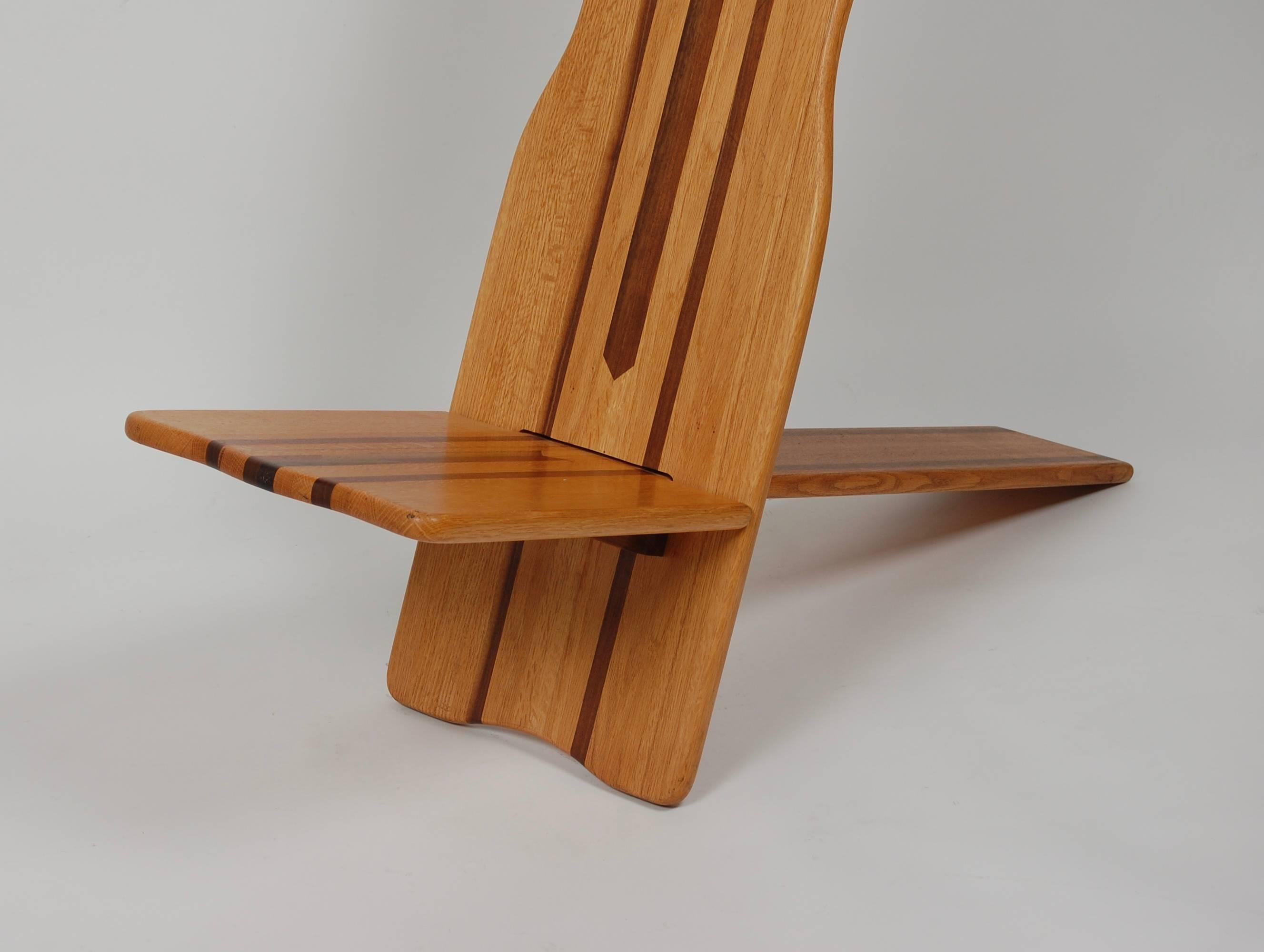 Two-piece slat chair constructed of ash, California walnut and black walnut created during the 1970s from an estate in Bolinas, California. The designed is inspired by the African Chiefs chair.