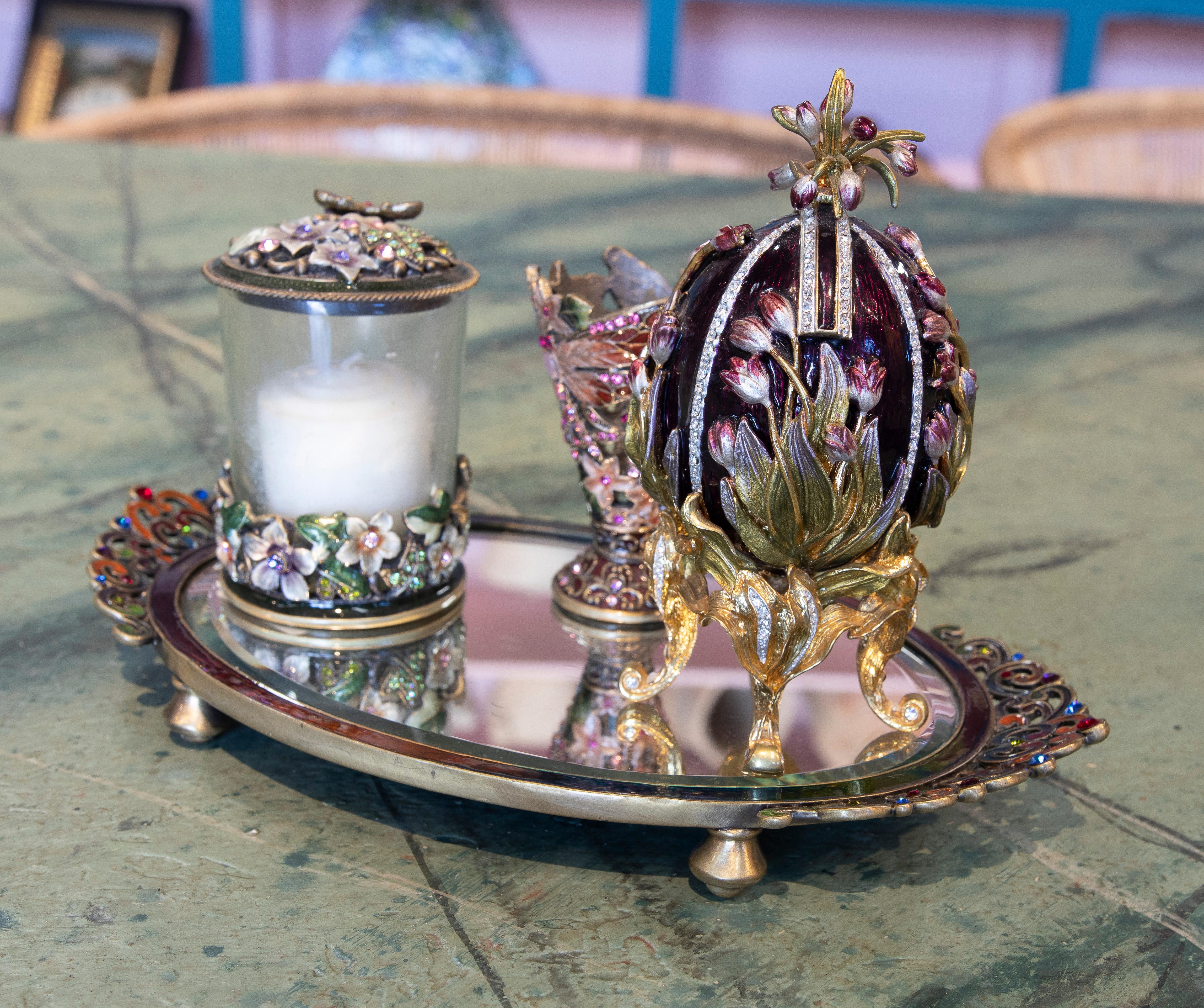 Exquisite 1970s California's Two's Company cloisonné decorative set consisting of a tray with, cup, Fabergé style egg and candle holder with lid. All adorned with vitreous enamel and semiprecious gemstones.