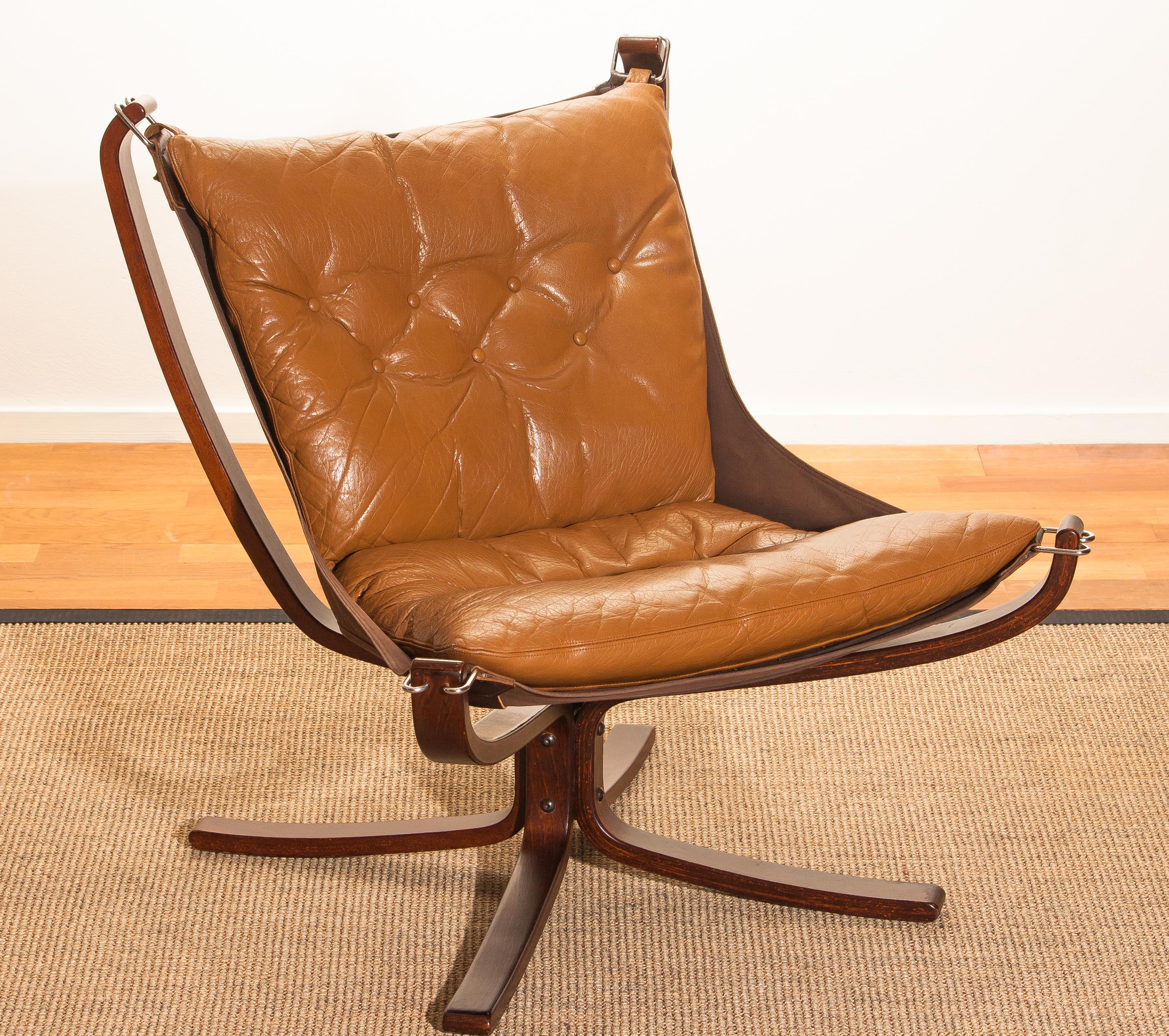 Wonderful armchair designed by Sigurd Ressell Norway.
The chair is in a very good original condition.
Both, the camel leather seating as the wooden frame are in perfect condition.
Period 1970s.
Dimensions: H 100 cm, W 80 cm, D 80 cm, SH 40 cm.
 