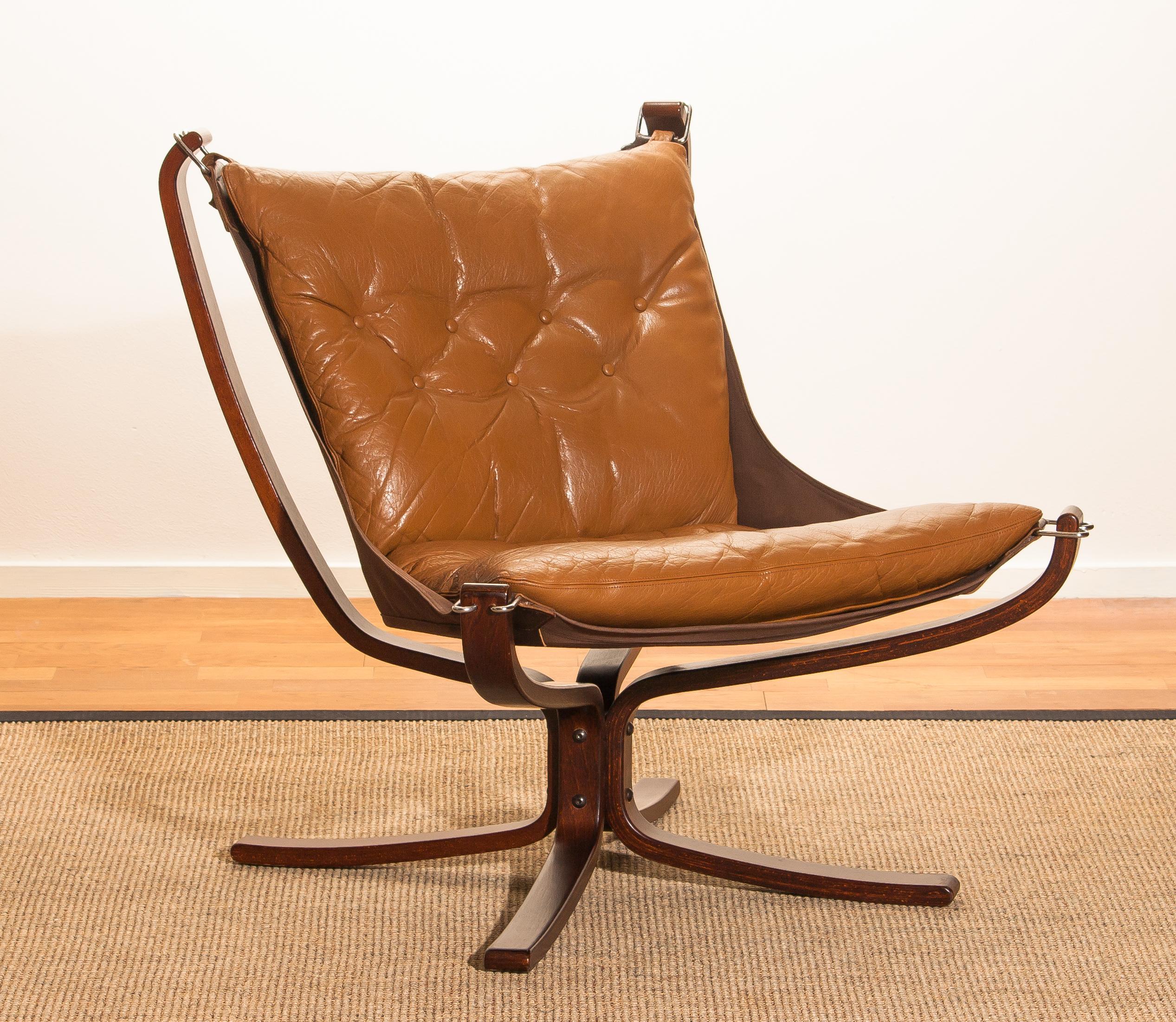 Wonderful armchair designed by Sigurd Ressell Norway.
The chair is in a very good original condition.
Both, the camel leather seating as the wooden frame are in perfect condition.
Period 1970s.
Dimensions: H 100 cm, W 80 cm, D 80 cm, SH 40 cm.
 
