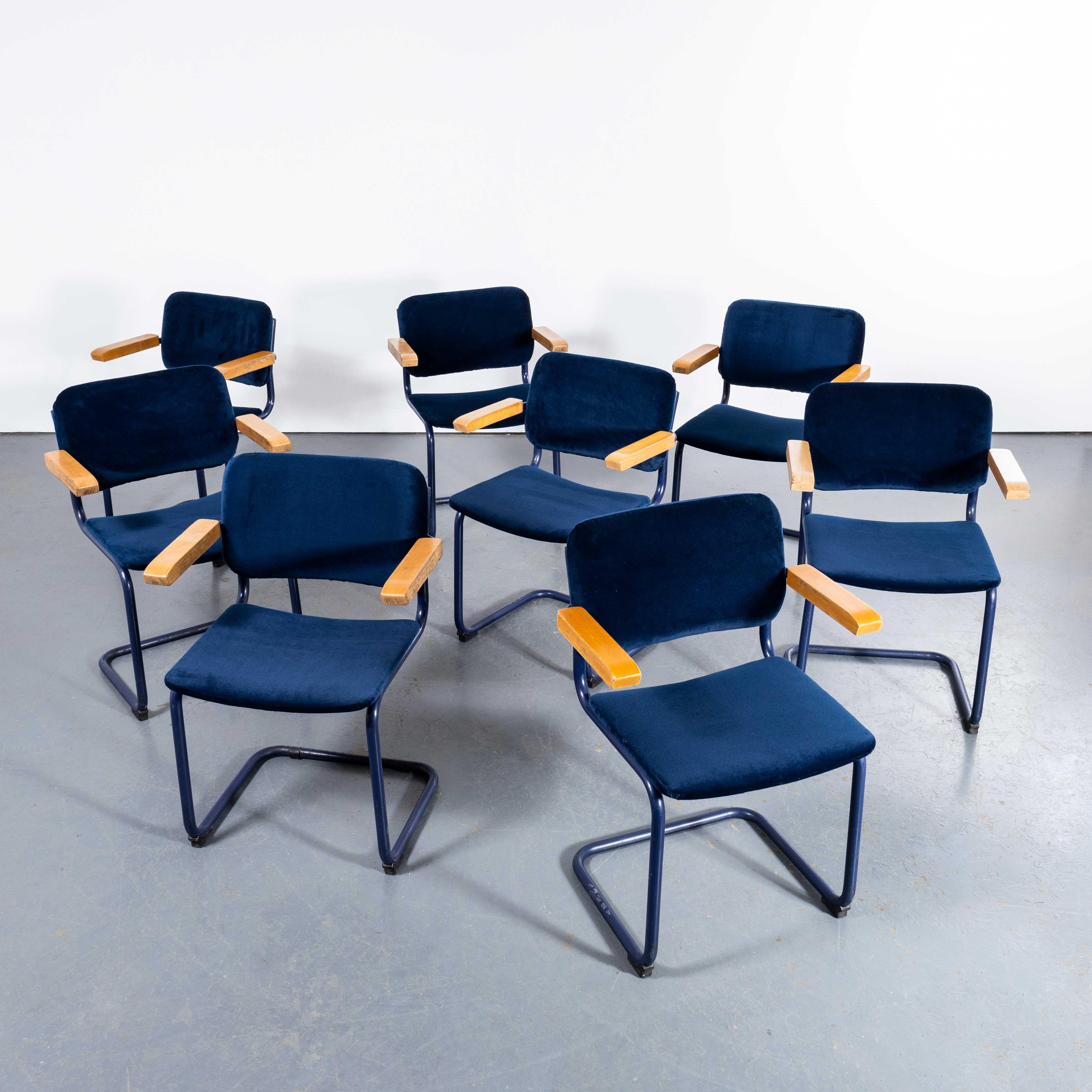 1970's Cantilever Blue Frame Dining Chairs With Deep Blue Upholstery - Set Of Eight. 

Classic Bauhaus style cantilever frame dining chair produced with chrome frames and reupholstered seats and backs and beech capped arms. Of good size and