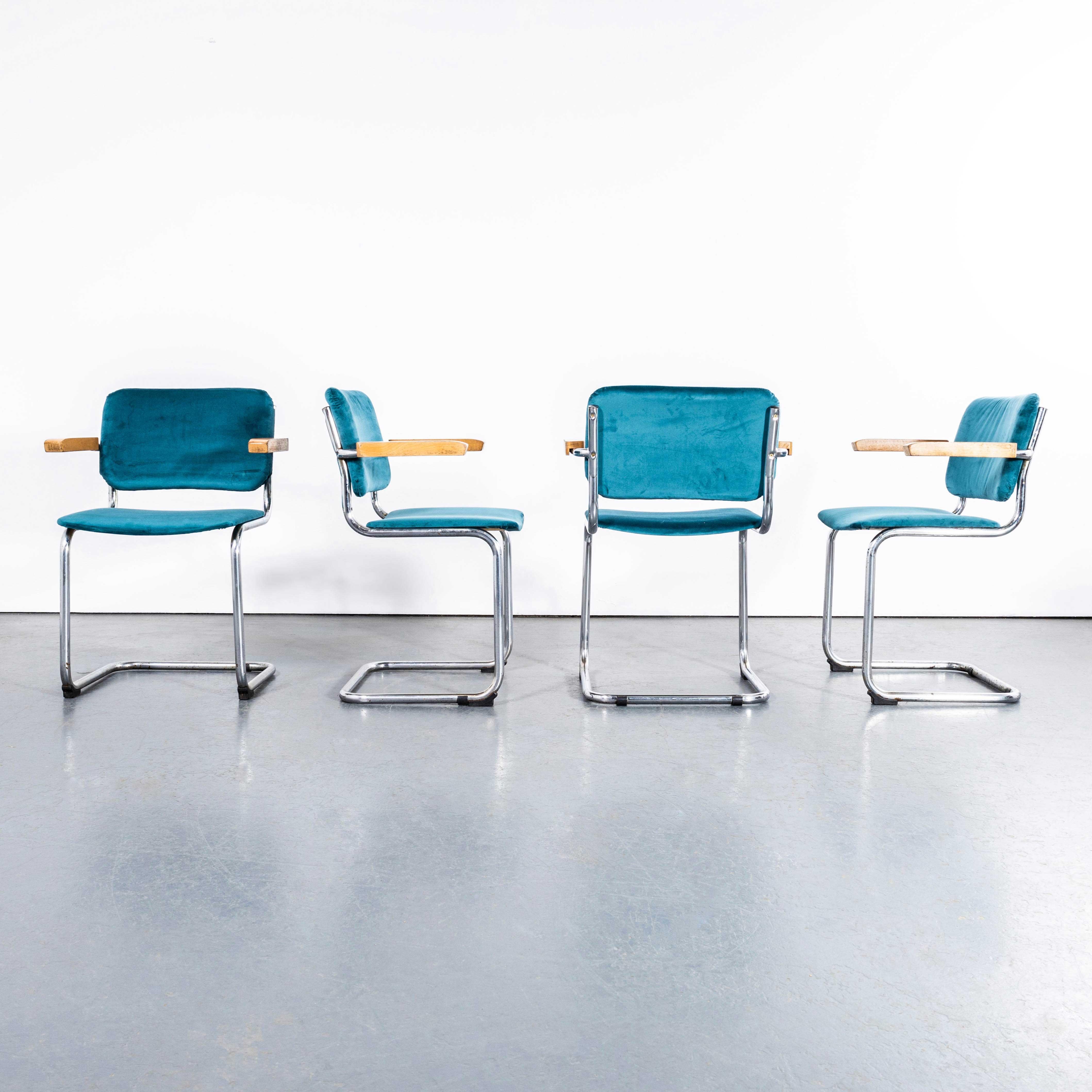 1970's Cantilever Chrome Frame Dining Chairs With Turquoise Upholstery - Set Of Four. 

Classic Bauhaus style cantilever frame dining chair produced with chrome frames and reupholstered seats and backs and beech capped arms. Of good size and