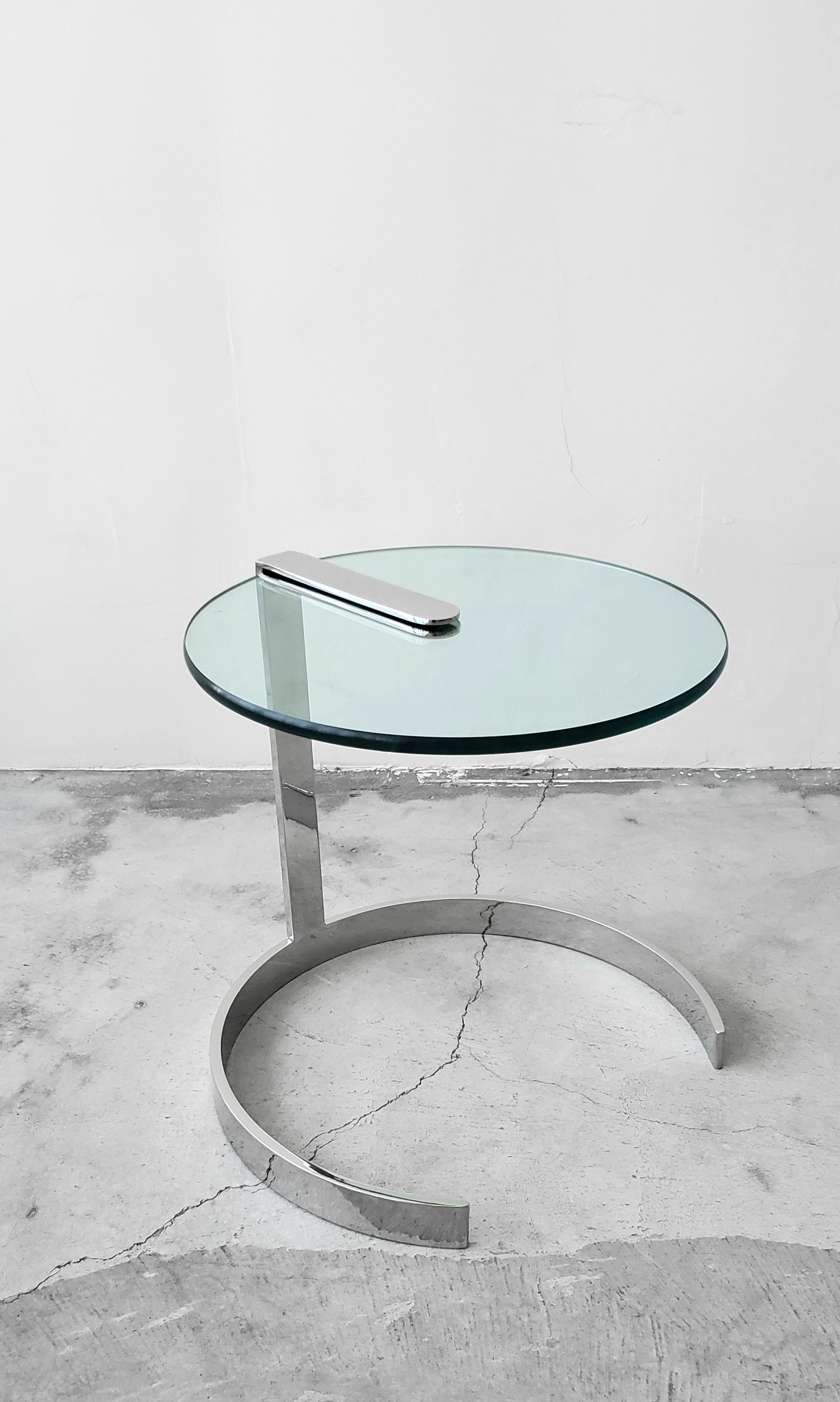 Absolutely gorgeous, polished stainless steel and glass cantilever side table. A smaller table, but not small on style. Perfect size next to a chair or between 2.

Most likely a custom piece, this table is a quality piece. Heavy, and well made in