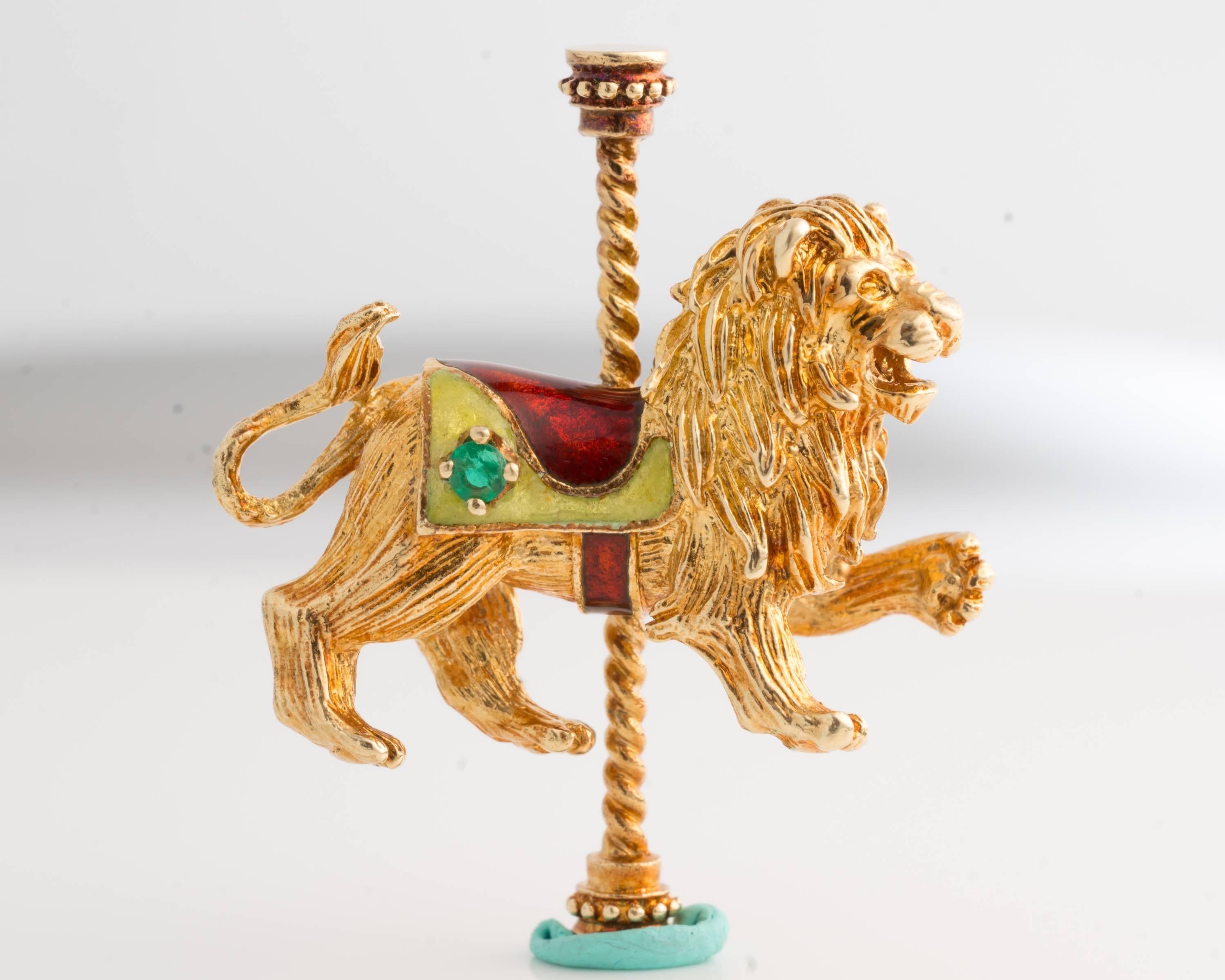 1979 Royal Roaring Carousel Lion Brooch Pin - 14K Yellow Gold, Emerald, Enamel

Features a Roaring Royal Gold Lion with Outstretched Paw, Enamel Saddle and an Emerald Accent. 
This exquisitely detailed Lion is carefully crafted from rich 14K Yellow