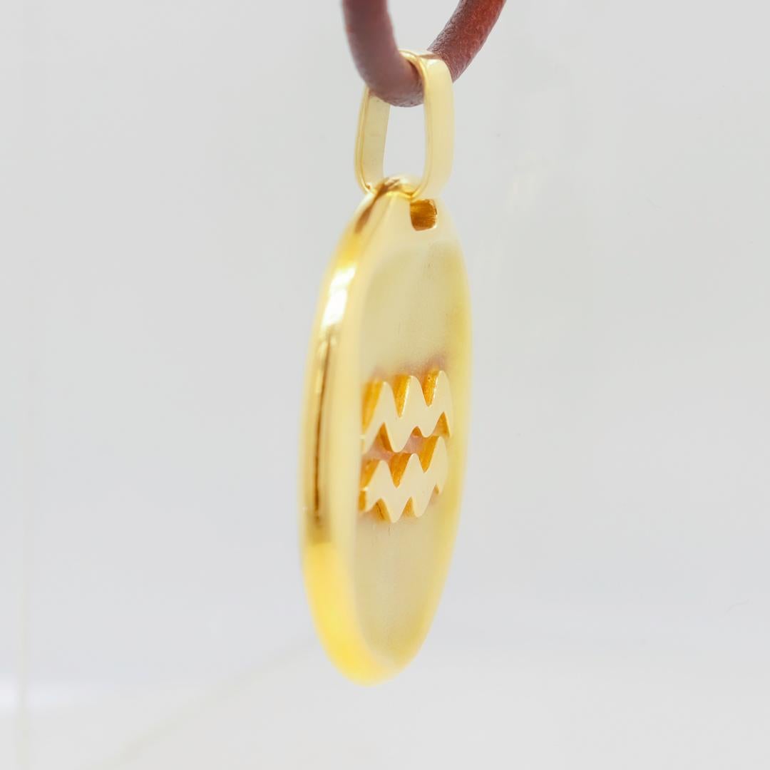 Women's or Men's 1970's Cartier 18k Gold Aquarius Zodiac Pendant by Georges L'Enfant