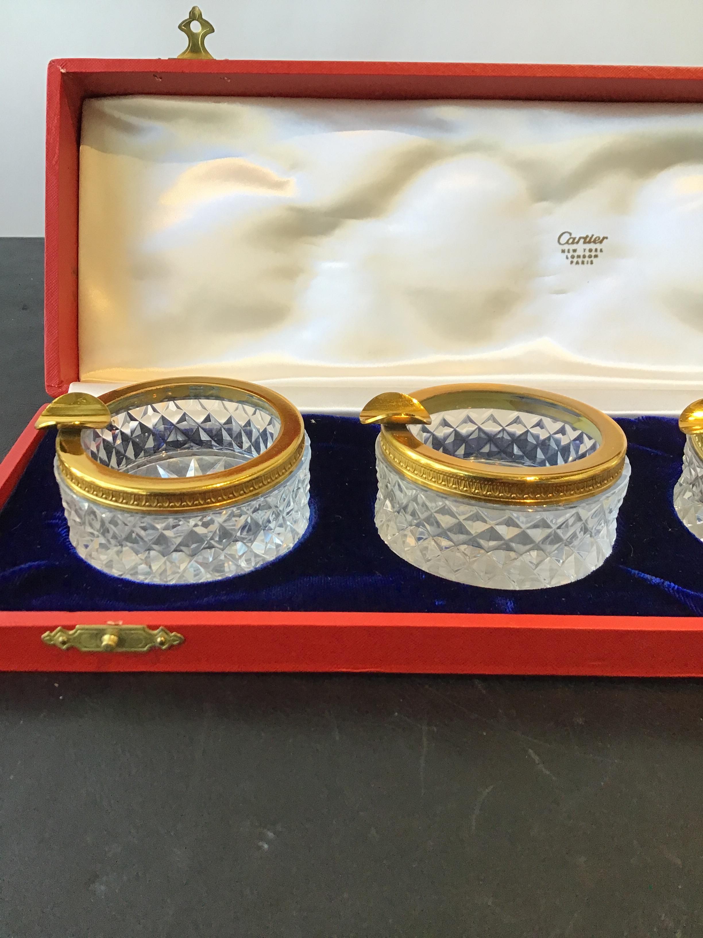 1970s Cartier crystal ashtray set with bass rim. Never used. Super chic.