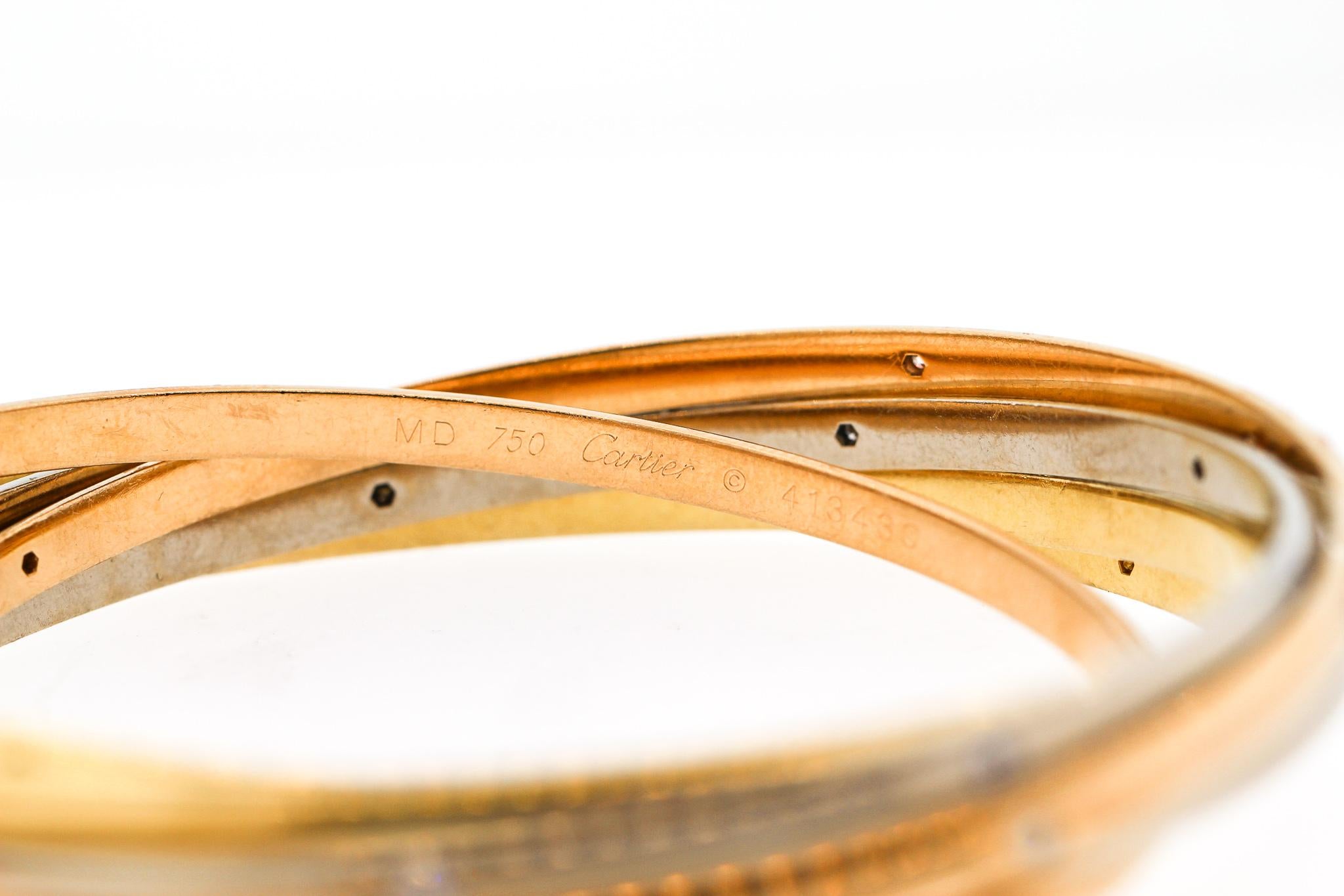 1970s Cartier Tri-Color 18 Karat Gold Diamond Rolling Ring Bangle In Good Condition In New York, NY