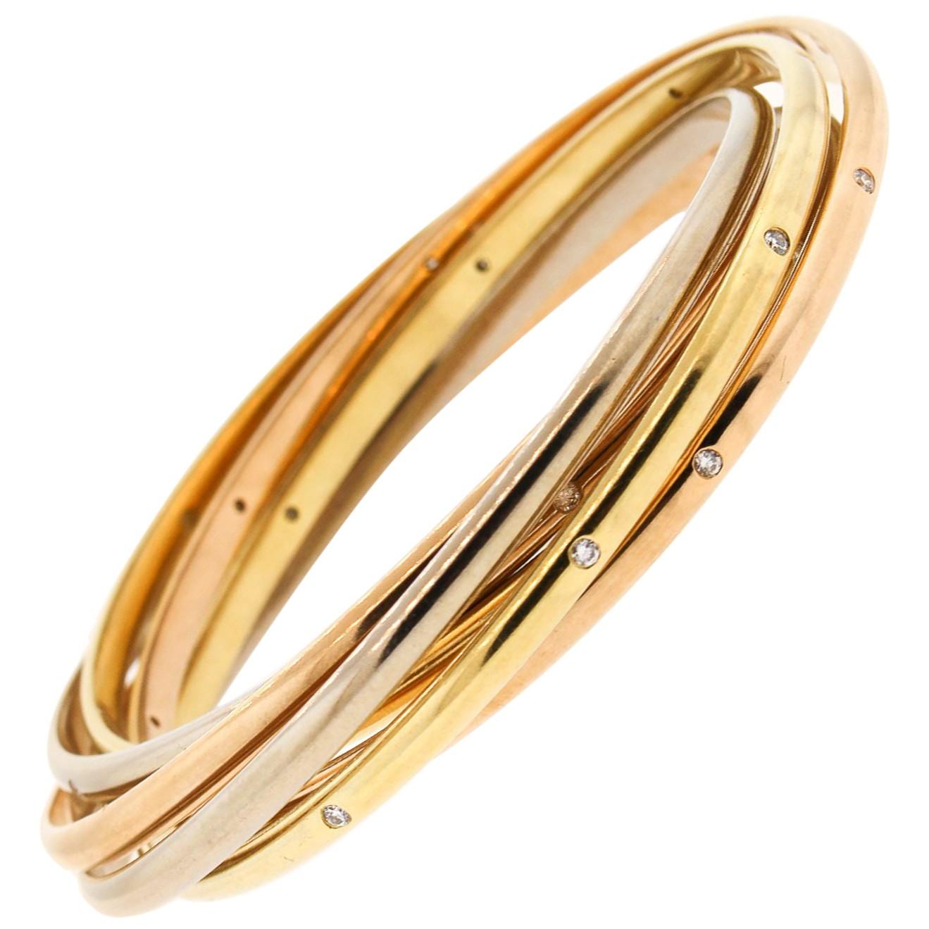 1970s Cartier Tri-Color 18 Karat Gold Diamond Rolling Ring Bangle