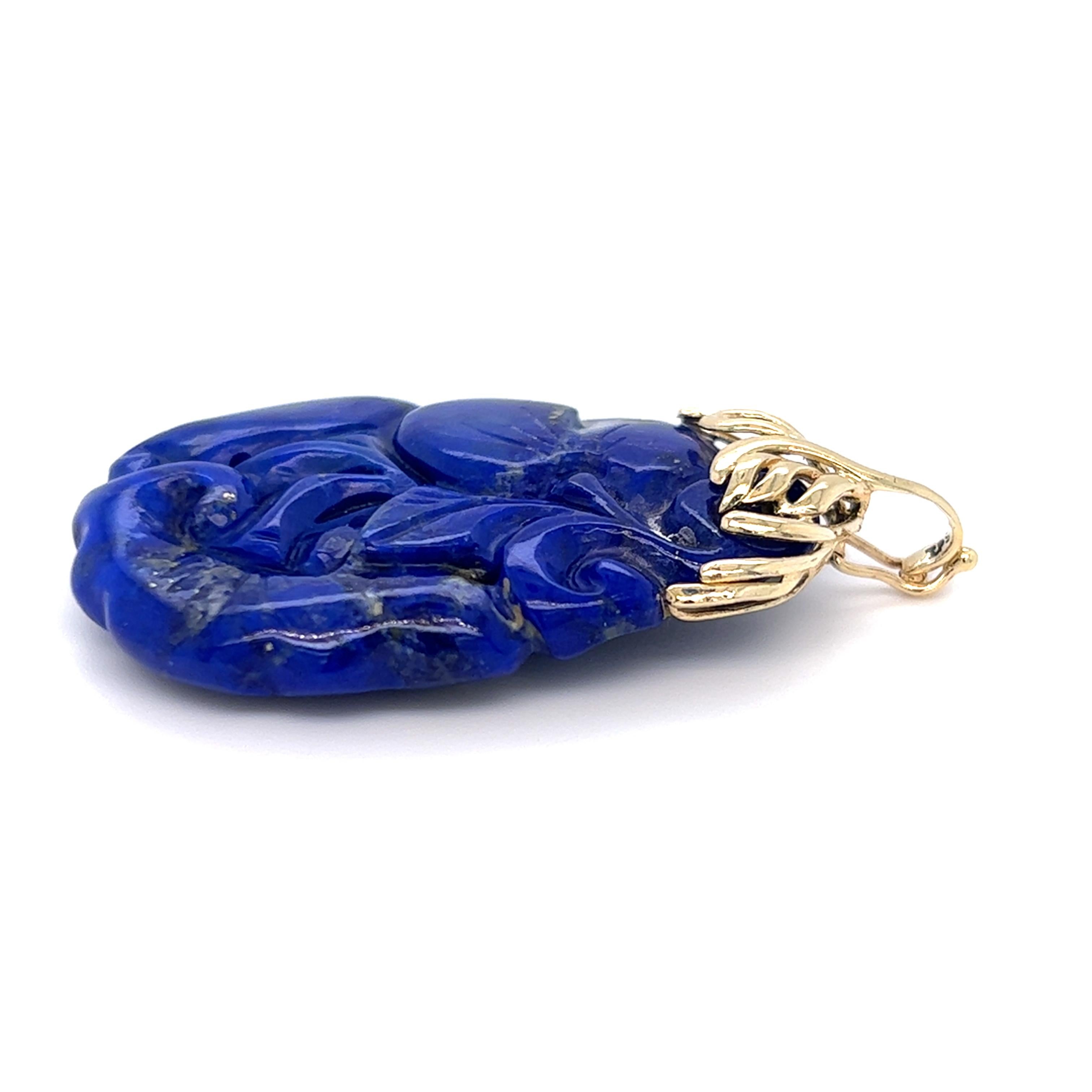 Oval Cut 1970s Carved Lapis Lazuli Pendant with 14 Karat Gold Enhancer Bail