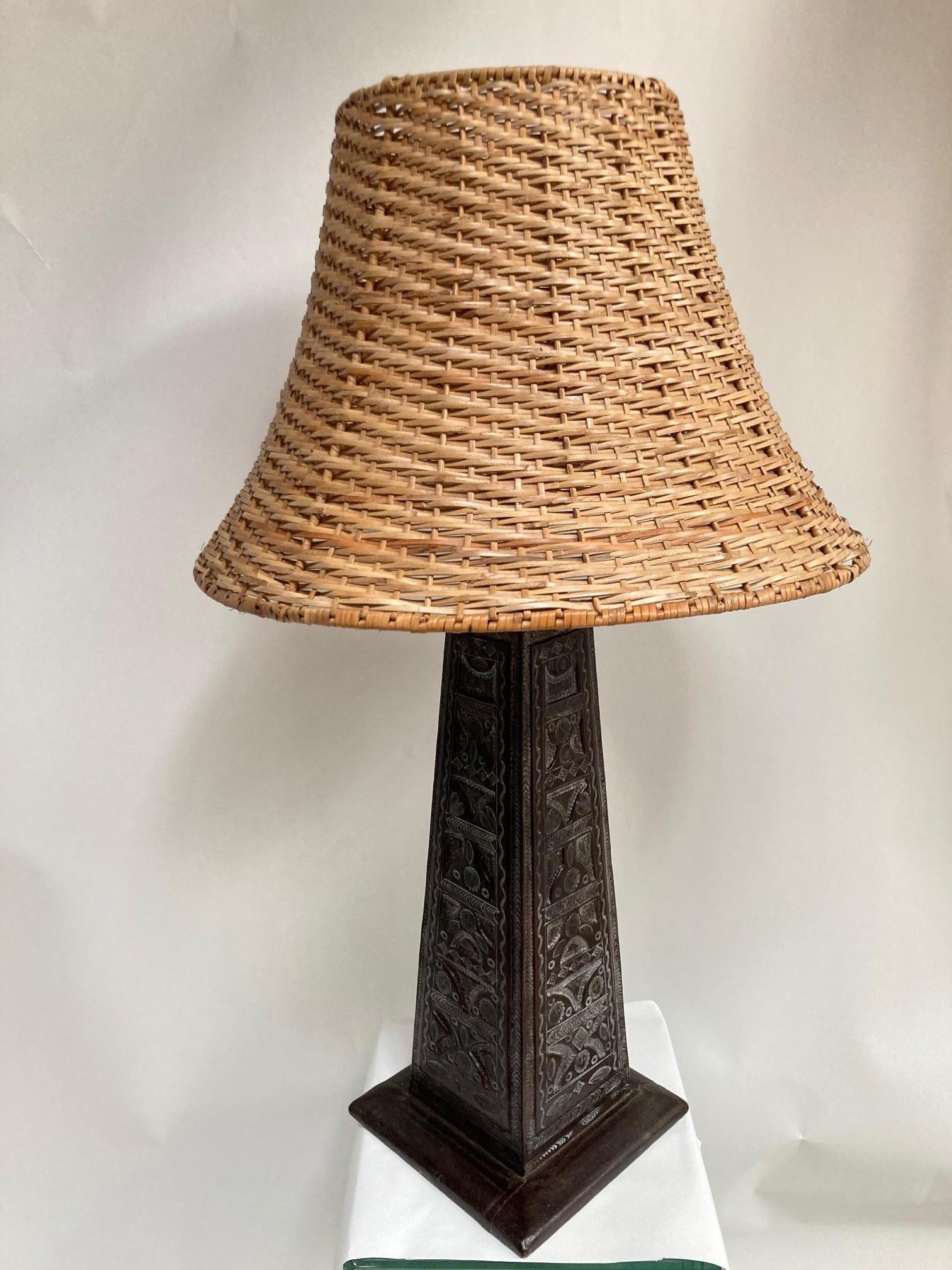 1970's carved leather lamp
Shade not included.