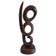 Escultura tallada en espiral de palisandro de los años 70 sobre base de palisandro