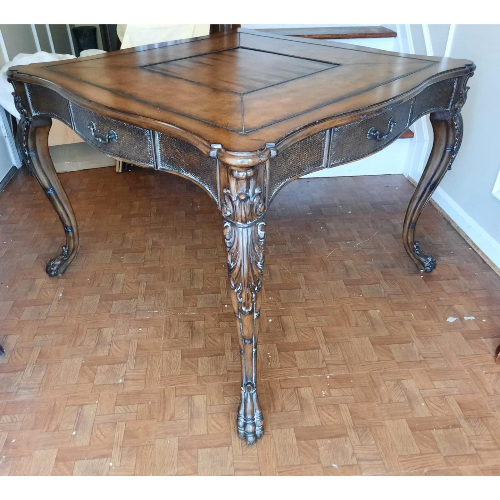 Arts & Crafts vintage walnut game table. Reversible chess game board. Leather Insert Table Top, intricately carved Legs flanked with paw feet. Four drawers for games pieces and accessories. Table comes apart for easy handling,in fact each leg is