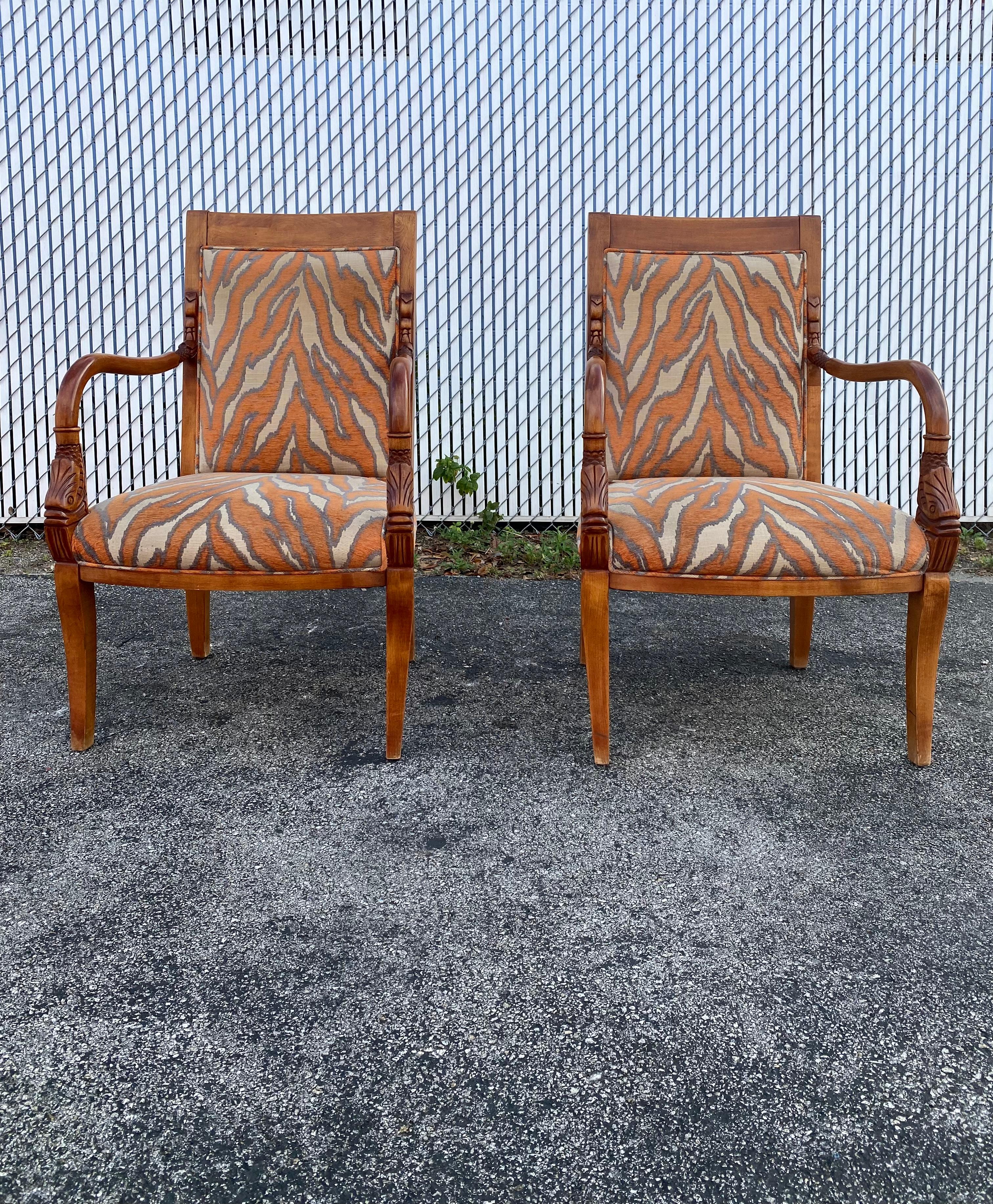 The vintage chairs and ottoman set is packed with personality! Outstanding design is exhibited throughout. Stylish hand carved goldfish with sculptural bentwood frames and rich wood tone is complementary to the zebra style upholstery. The richness