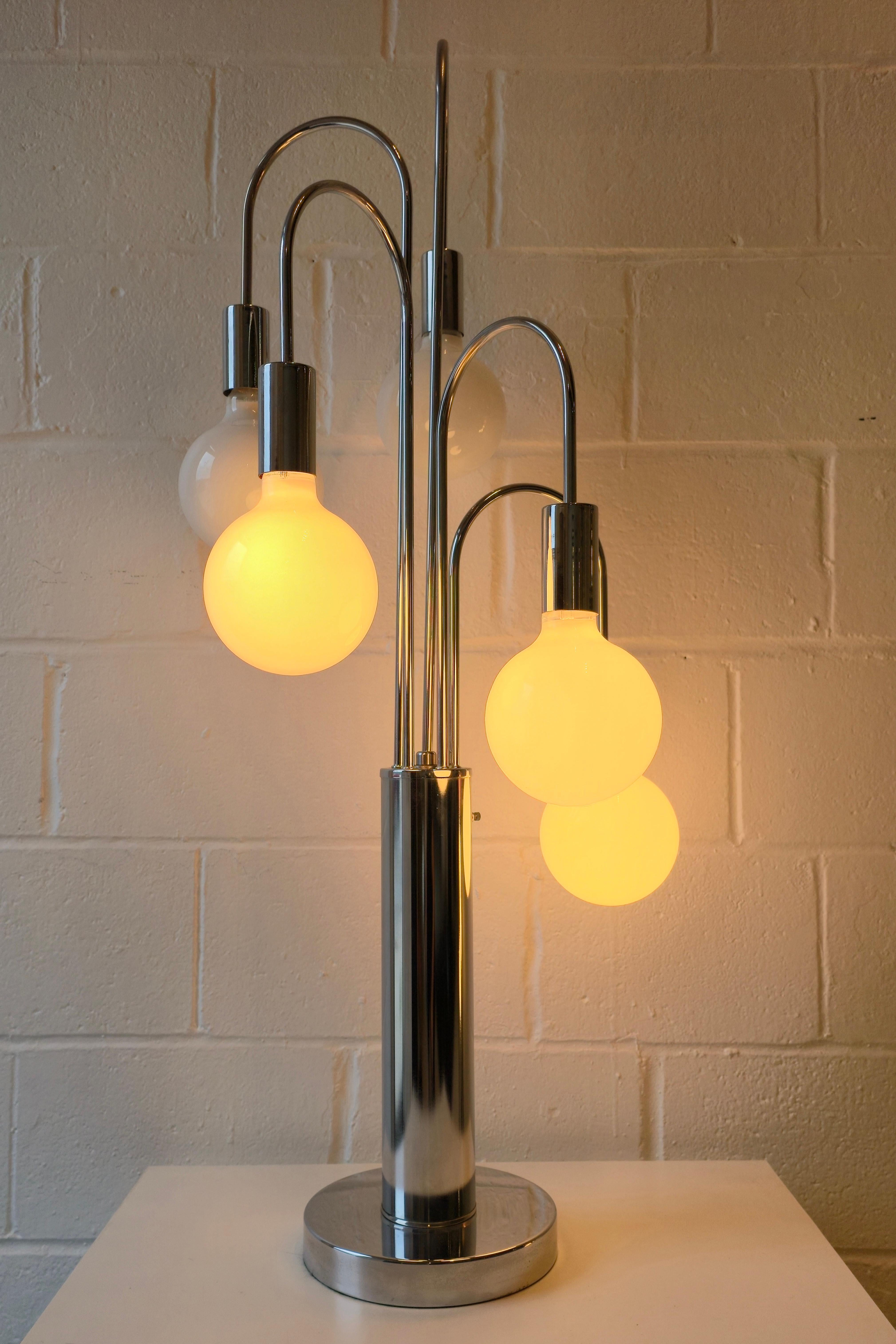 Stunning chrome cascading waterfall table lamp attributed to Robert Sonneman. It was made in the 1970s. This table lamp has a gorgeous waterfall form that features five lights of varying heights. G40 bulbs are fitted to the lamp. The lamp is