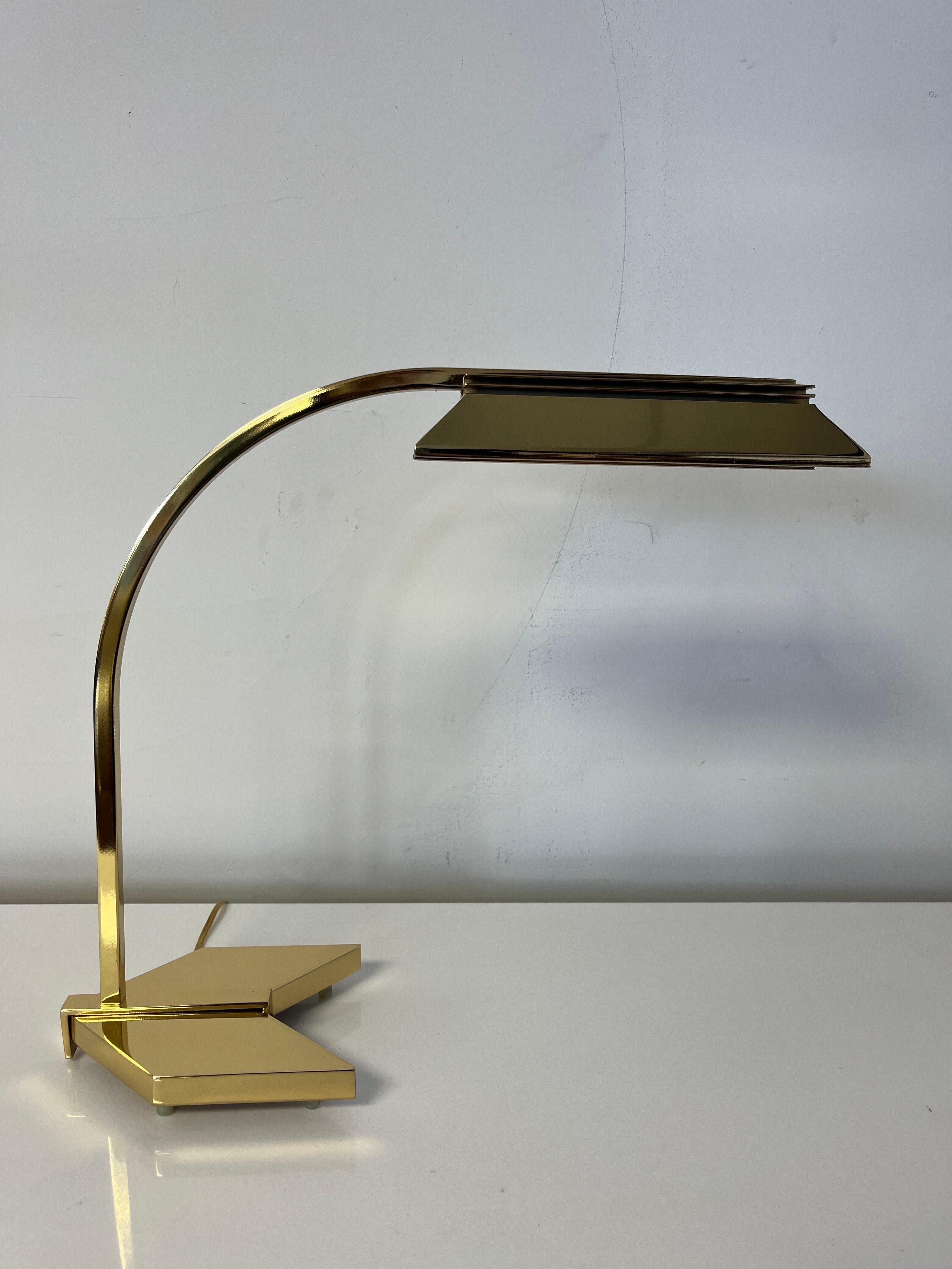 Sophisticated brass and chrome desk lamp. Great movement with sweeping arm. Brass nicely offset with chrome in shade. Newly replated and rewired. 
