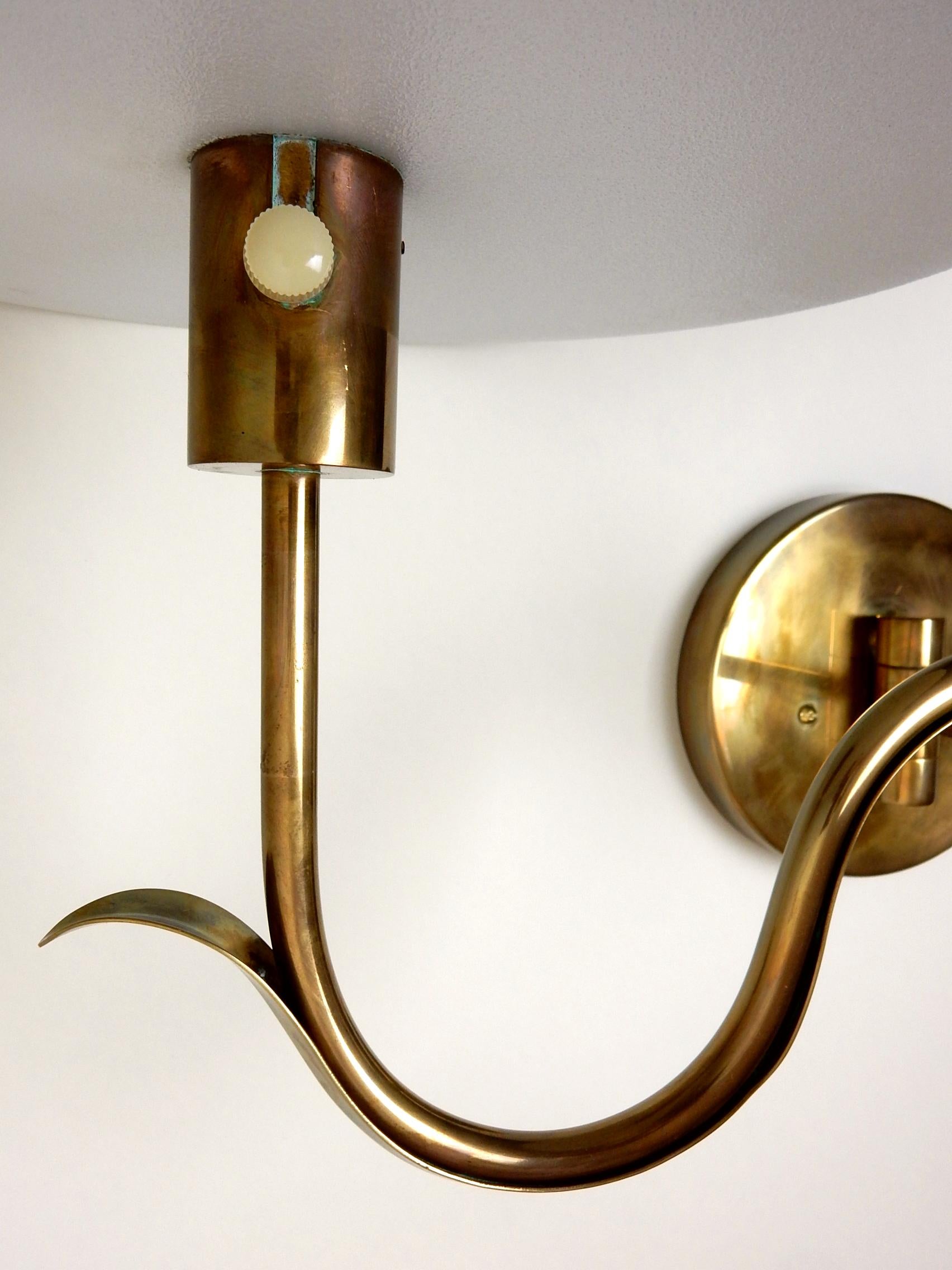 Lovely pair of Art Deco inspired swing arm sconces by Casella of San Francisco. 
13