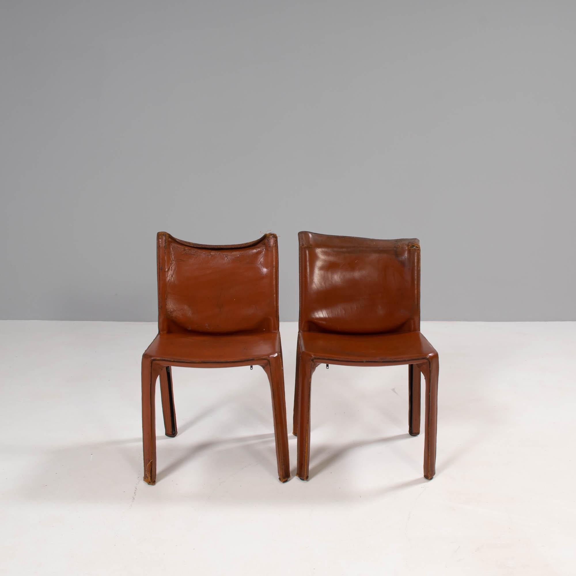 Designed by Mario Bellini in 1977, the Cab dining chairs have since become a signature piece in the Cassina furniture collection.

These original 190s dining chairs are constructed from a steel frame and are covered in cognac leather upholstery,
