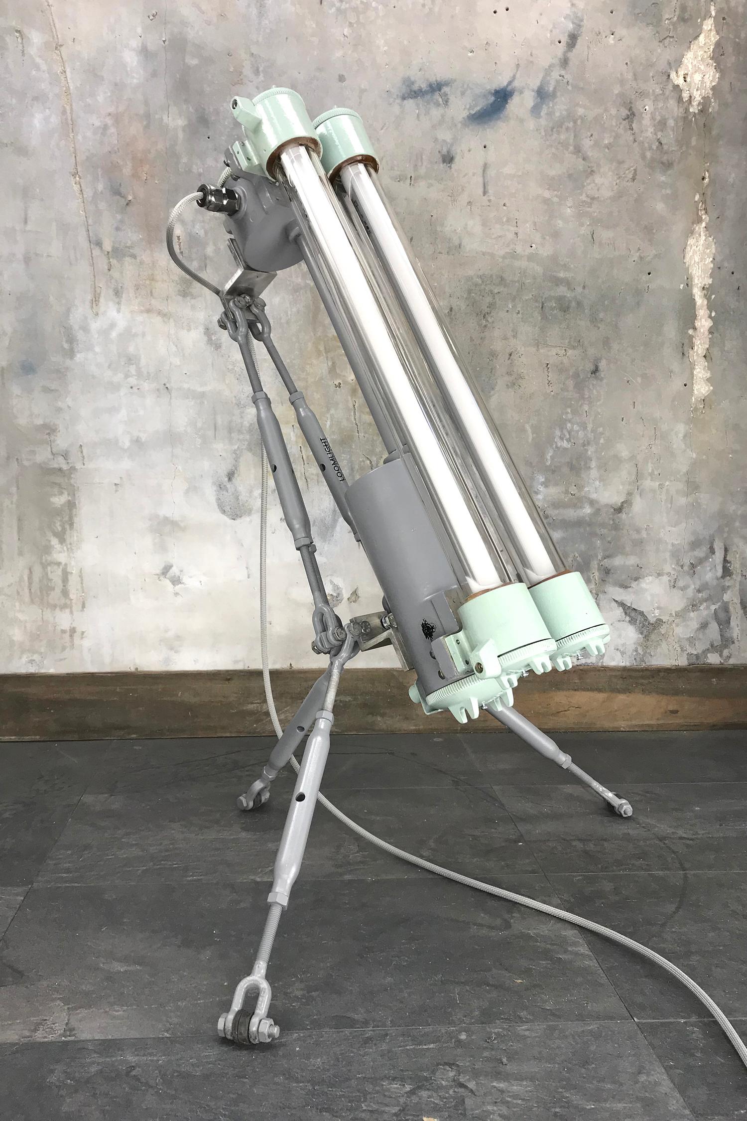 Reclaimed and modified 1970s Daeyang Electric Co. Ltd flame proof luminaire with fully updated electrics and fitted with T8 Warm white LED tubes.
 
The tube light has been fitted to a custom made tripod was comprises of 6 rigging screws to create
