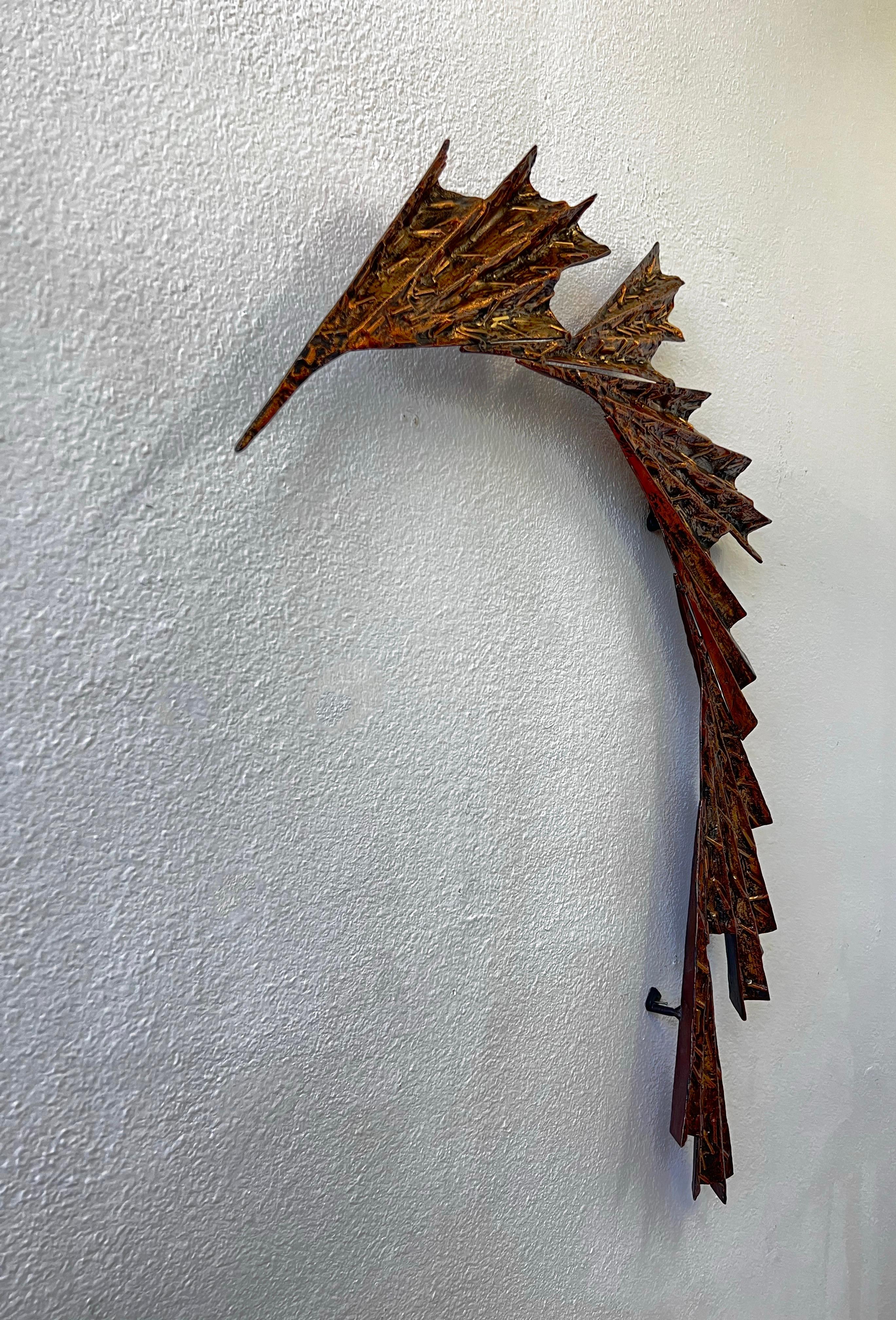 Cool 1970’s cast aluminum abstract wall sculpture with a patinated copper finish. 
It has three hooks to hang. 
Can be used indoors or outdoor. 

Measurements: 45” High, 33.5” Wide, 2.5-3” Deep. 