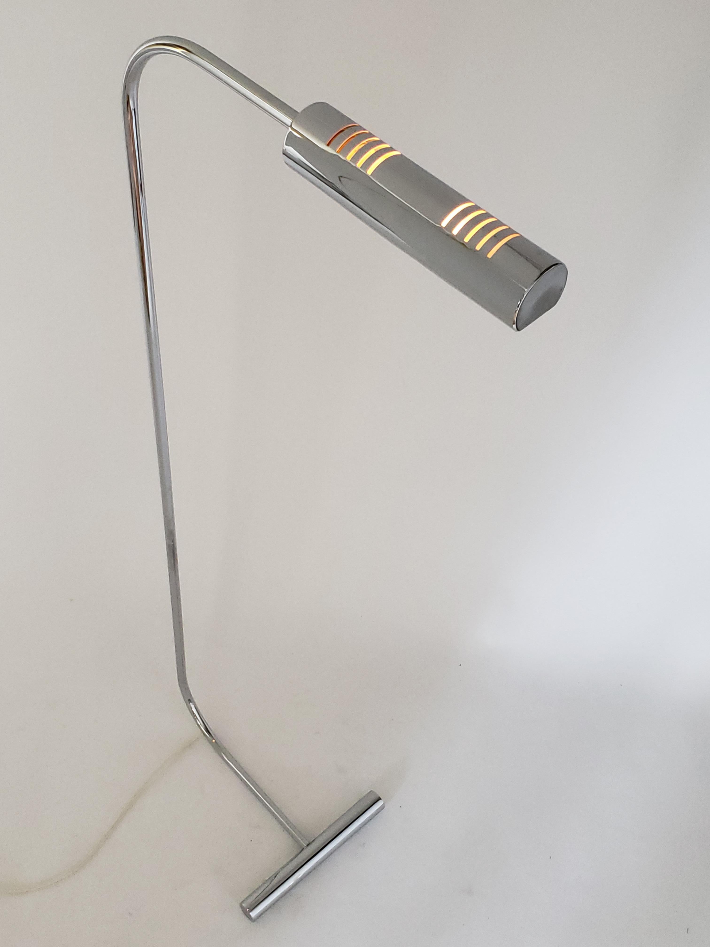 Minimalist modern floor reading lamp in the style of Cedric Hartman. 

Sturdy, well made construction. 

Heavy solid steel chromed base. 

Vented chrome shade measure 10 inches long. 

Contain one E26 size ceramic socket rated at 60 watt.