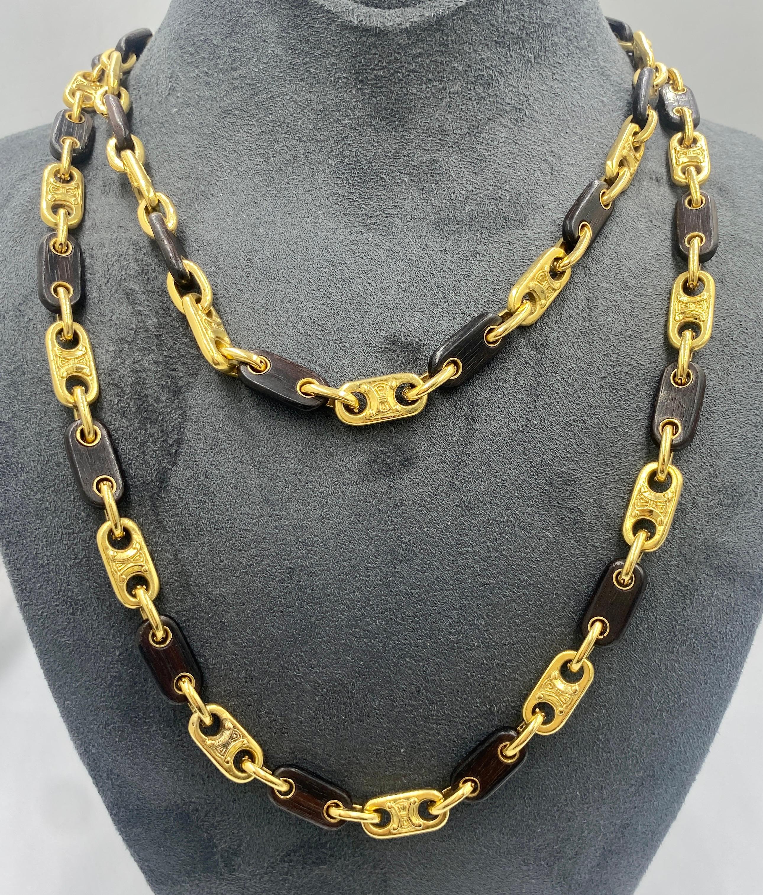 This necklace made in 1970s by Celine is a highly wearable piece with interlocking 18k gold and ebony links. The set also has a bracelet which is listed separately on 1stDibs. A photo of the bracelet is included below.