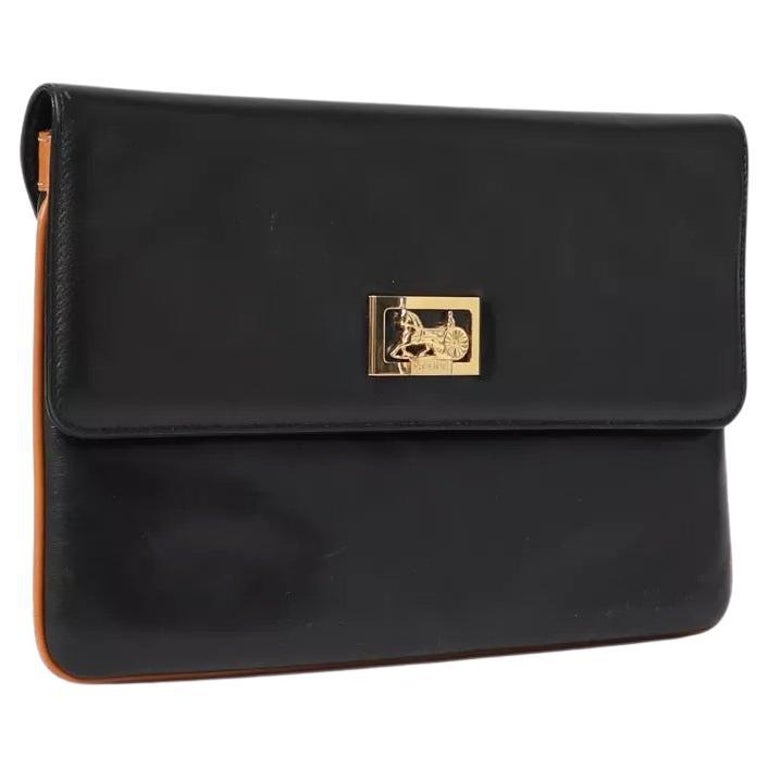 1970s Celine Black Leather Caleche Clutch at 1stDibs