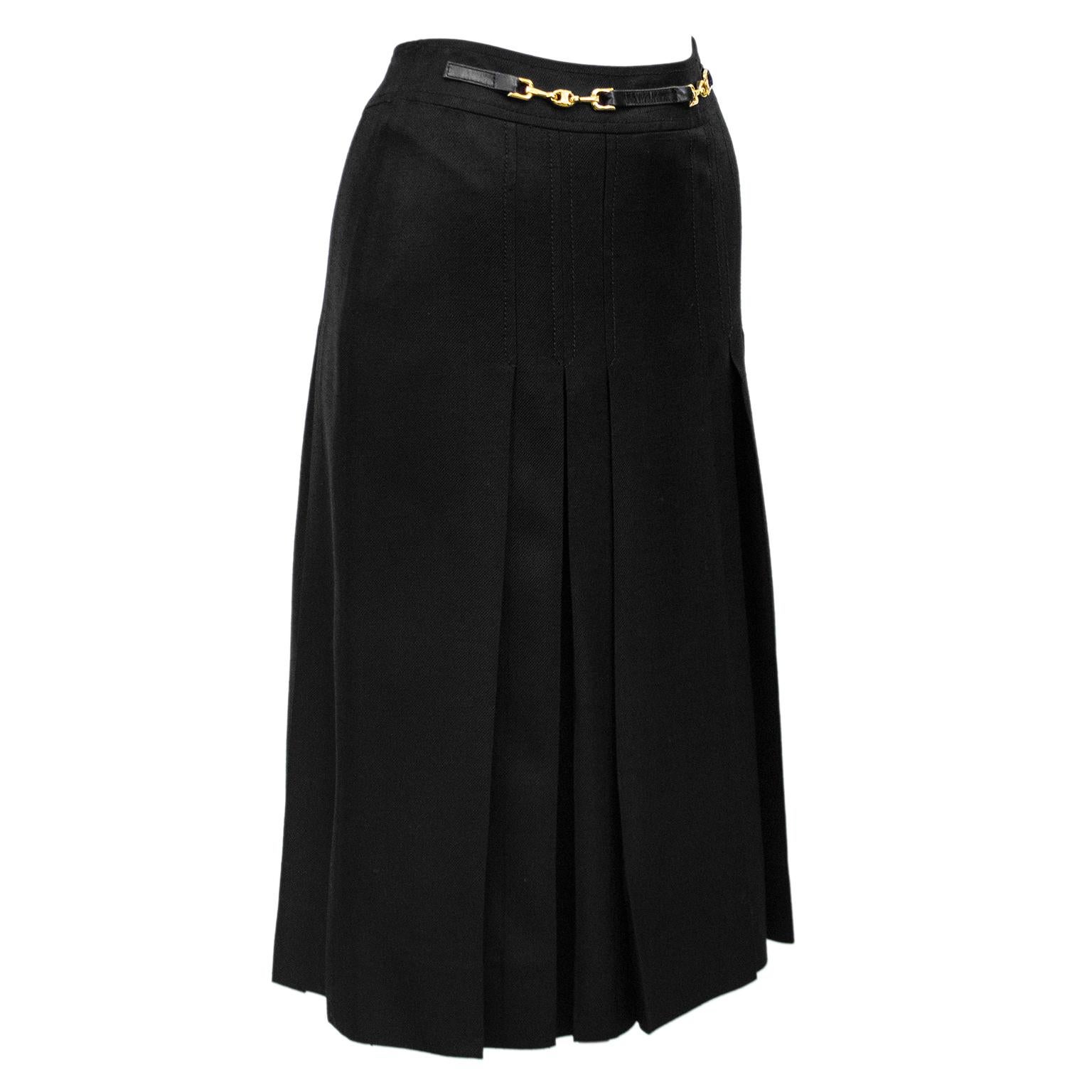 1970's classic Celine black viscose and silk skirt with half black leather and gold belt at waistband. Inverted stitched pleats on the front and back. Overall A line shape. In excellent condition, side zipper with hook and eye. Fits like a US size