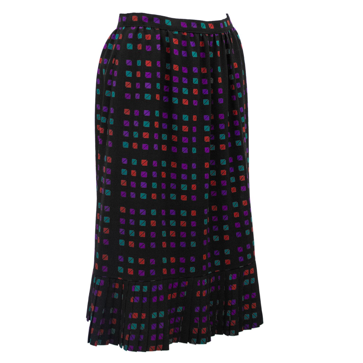 Fun & flirty 1970s Celine skirt. Black with turquoise, purple and red allover triangle/square geometric pattern. High waisted with slight aline shape and pleated hem. Excellent vintage condition. Fits like a US size 2