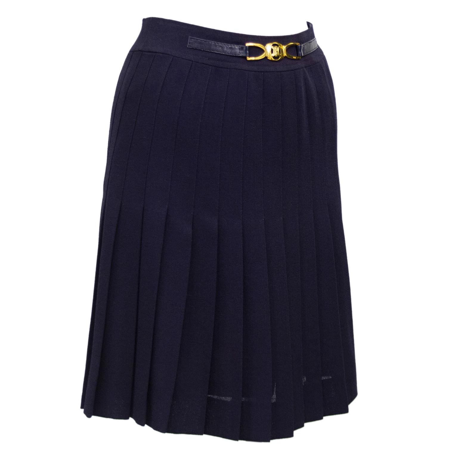 1970's classic Celine navy blue polyester and wool blend pleated skirt with half navy leather and gold belt at waistband. Overall A line shape. In excellent condition, back zipper with hook and eye. Fits like a US size 2. Made in France. Iconic