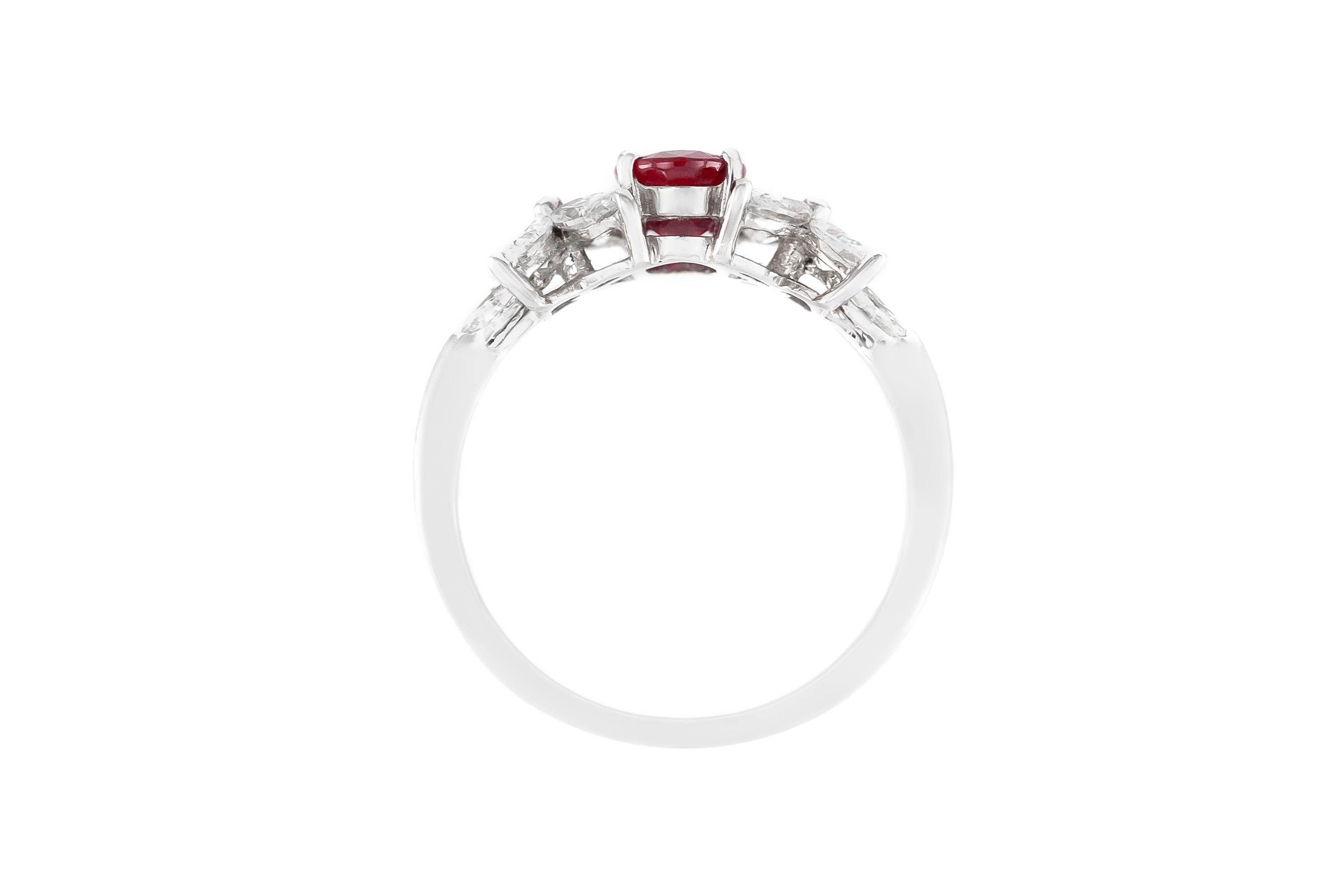 Finely crafted in 18K white gold with a 1.06 carat beautiful Oval cut center Ruby and 10 Marquise cut diamonds weighing a total of 0.93 carats.
Circa 1970s
Size 6
