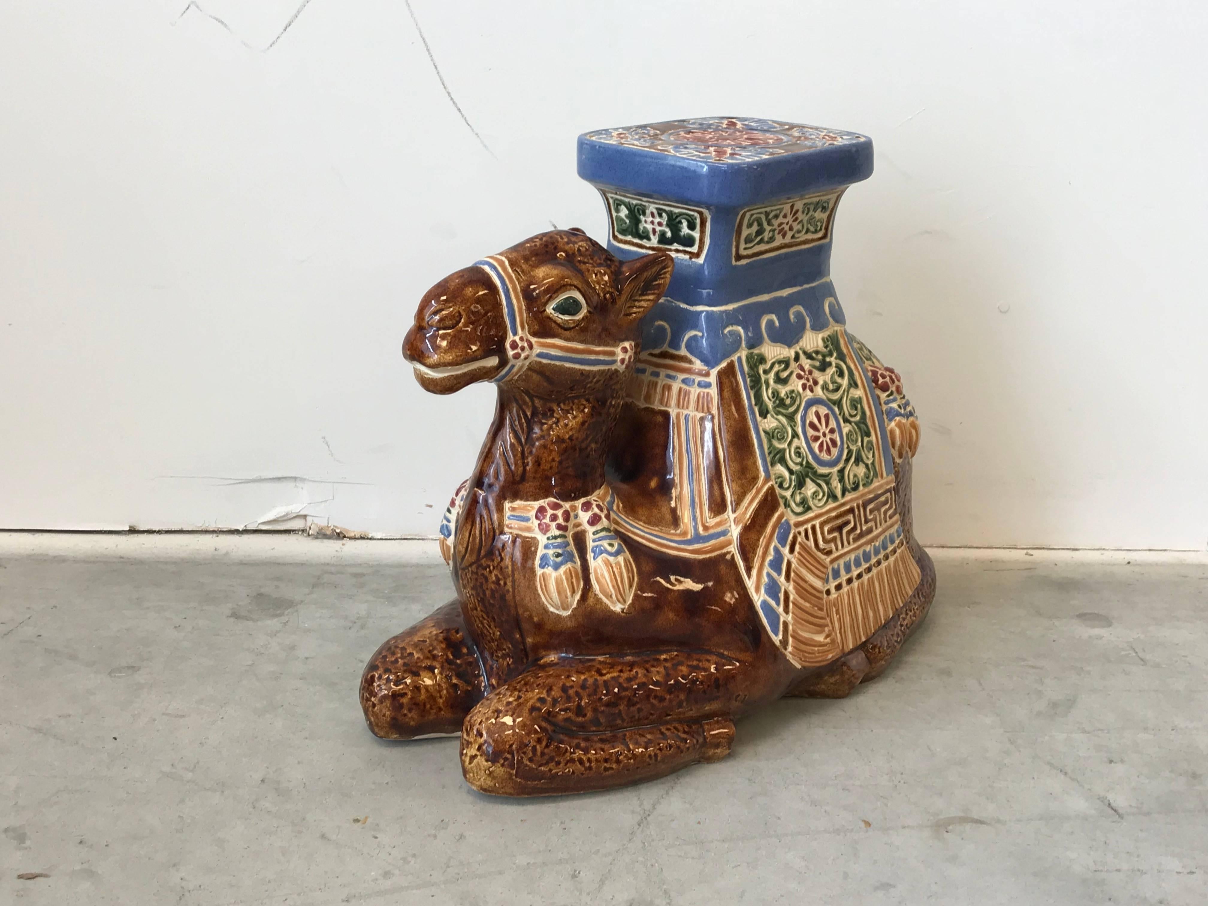 Offered is a fabulous, 1970s glazed-ceramic camel sculpture garden stool. The piece is in exquisite condition -- no chips, cracks, or discoloration. Perfect indoors or outdoors!