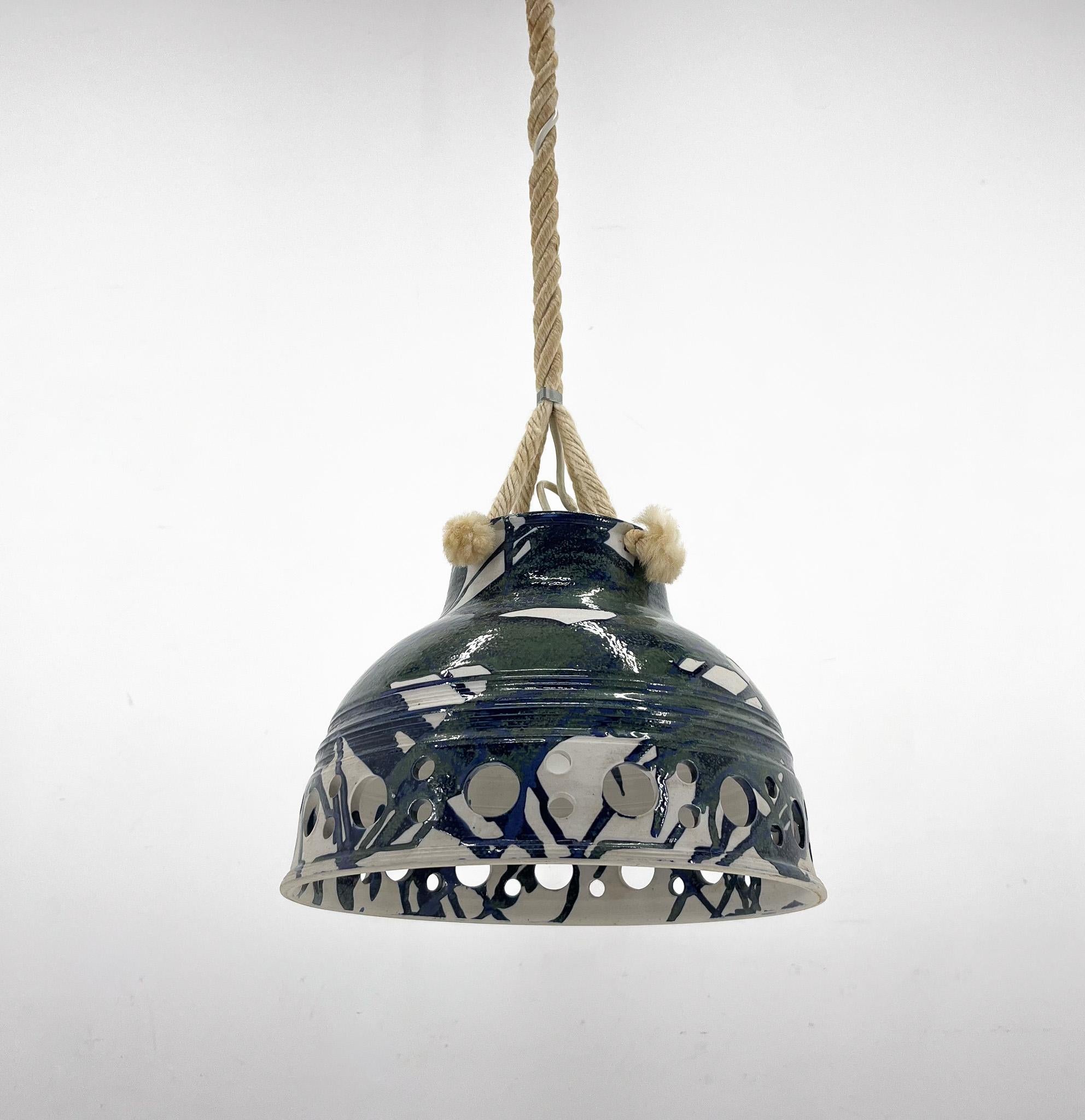 Long and heavy ceramic pendant light suspended on a rope. Manufactured in Denmark in the 1970's. Can be shortened upon request. Bulbs: 1 x E26-E27. US wiring compatible.