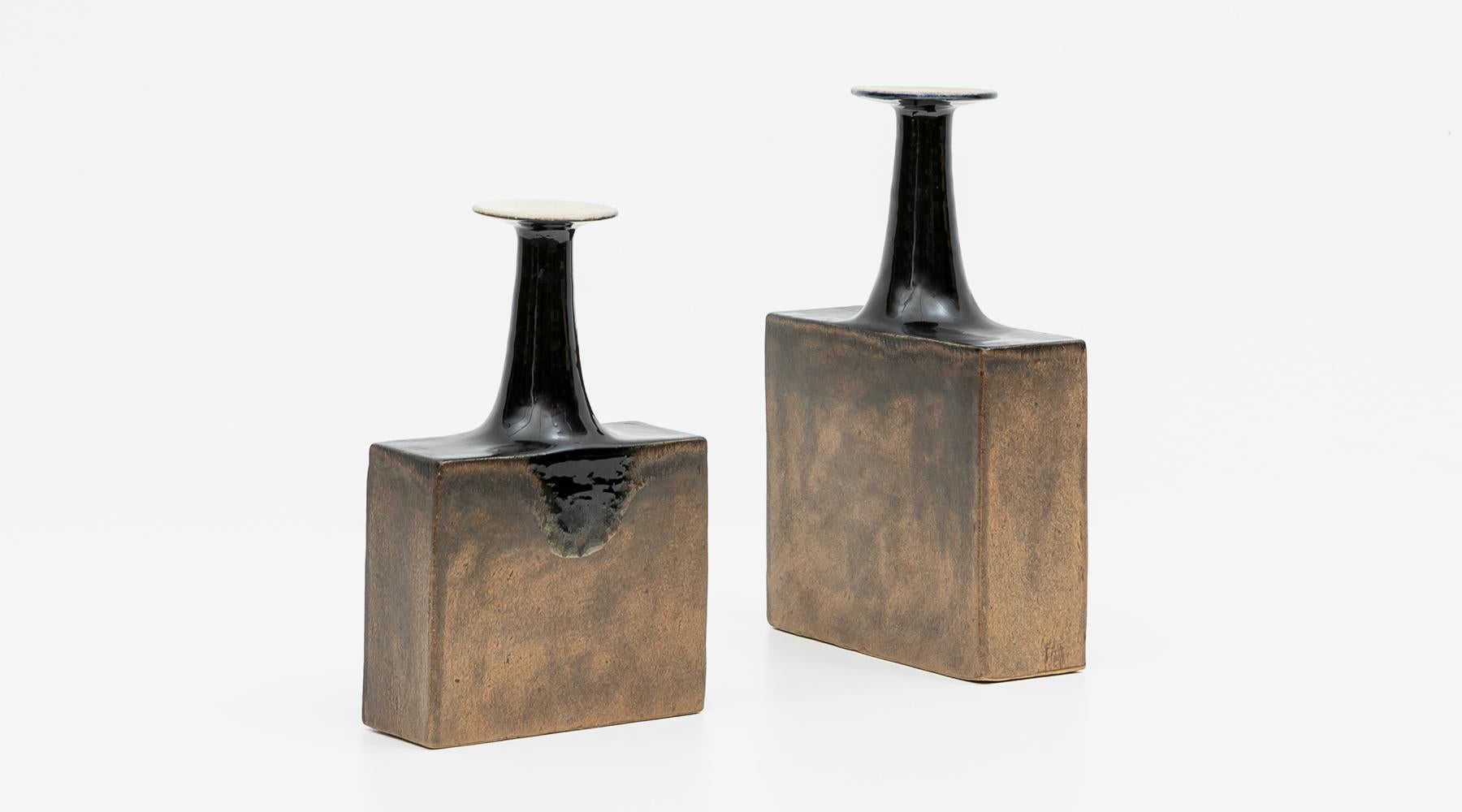 Set of two vases, ceramic, glazed, Bruno Gambone, Italy, 1970s.

Gorgeous vases by the multi-talented artist Bruno Gambone from the 1980s. They vary in height and width. This set comes in warm earth tones and black. The neck is in each case
