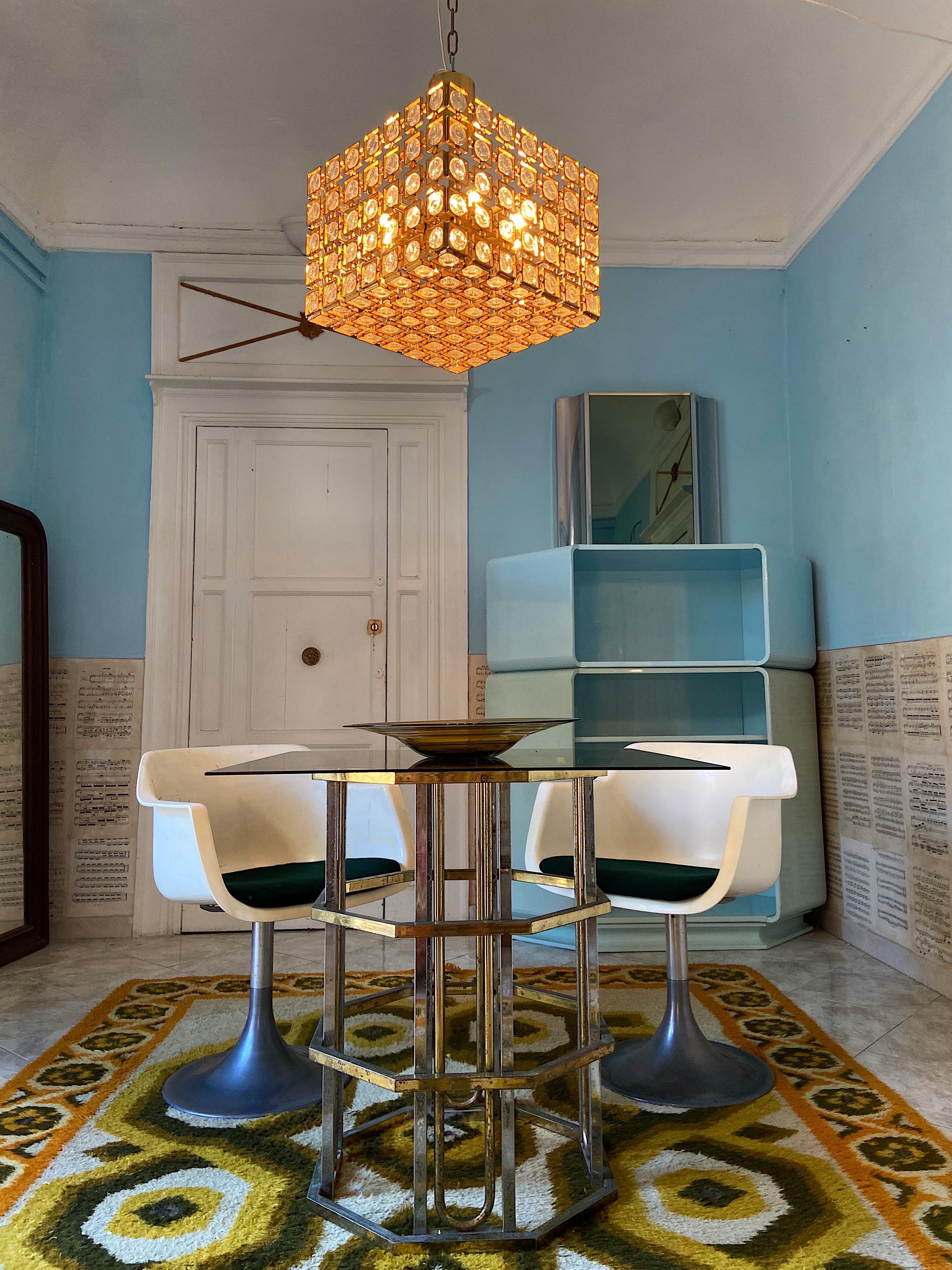 Very rare chandelier from Gaetano Sciolari Italy.
This beautiful piece underline the Italian 1970s glamour.
Golden brass and crystal in a cube in a stunning pattern.
The four sides and bottom of the chandelier are panels of individual squares