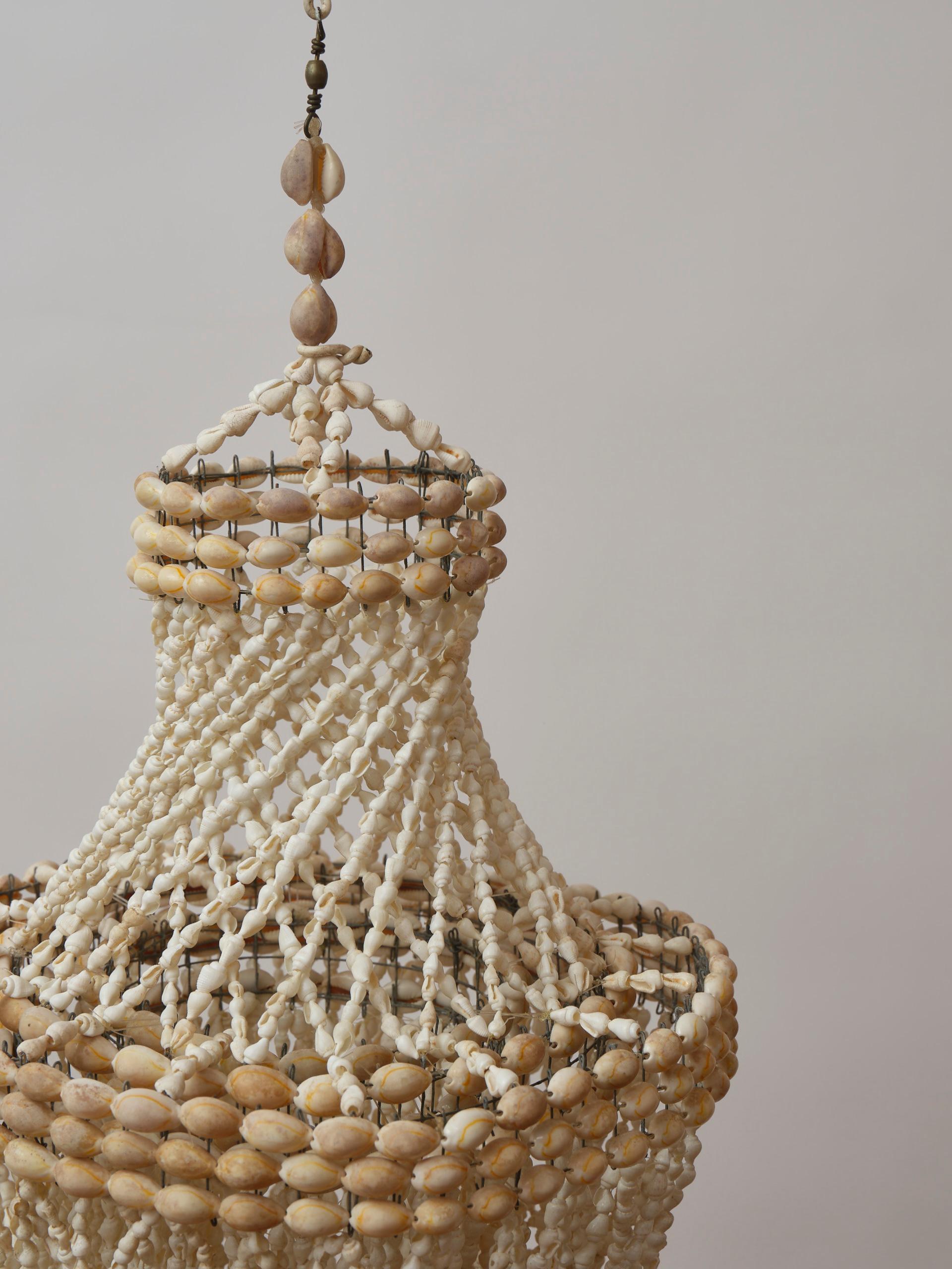 Late 20th Century 1970s chandelier in strings of natural shells For Sale