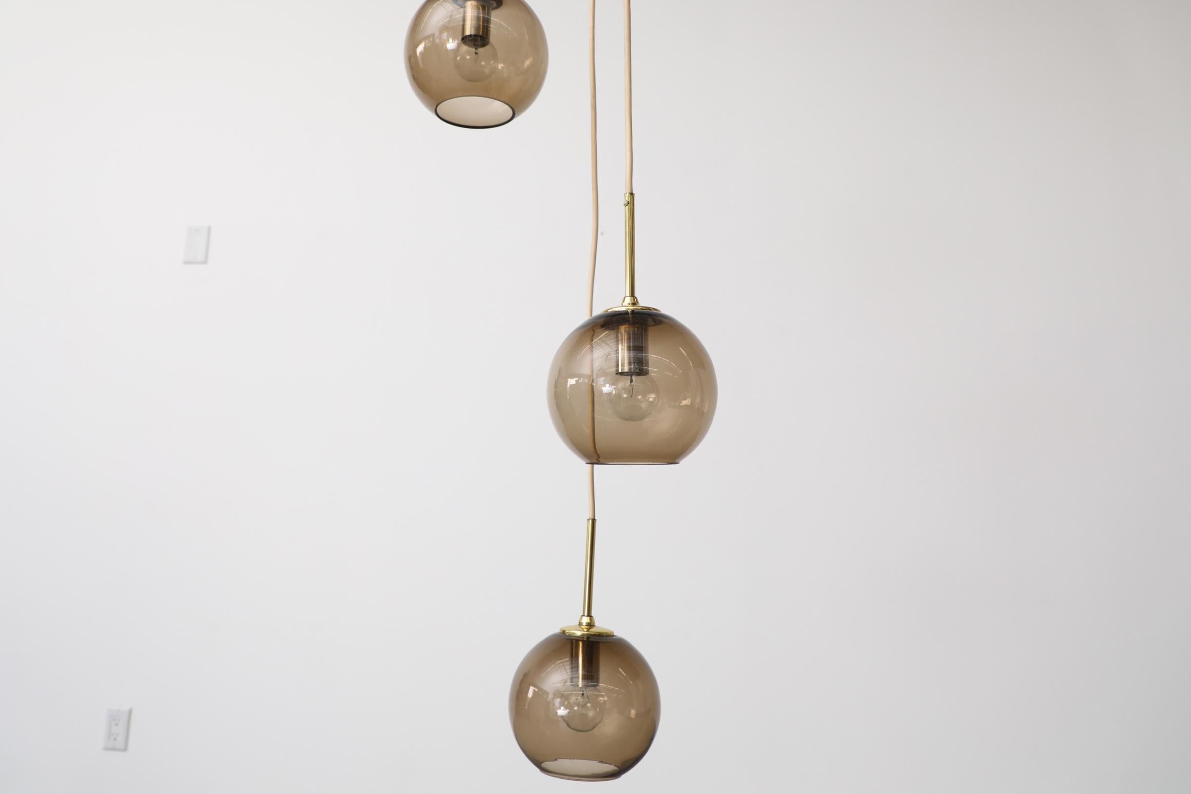 1970s Chandelier with 3 Smoked Glass Globes, Brass Hardware and Triple Canopy For Sale 5
