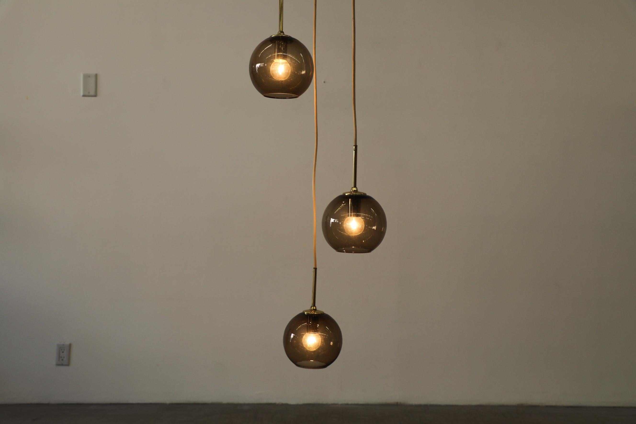 1970s Chandelier with 3 Smoked Glass Globes, Brass Hardware and Triple Canopy For Sale 3