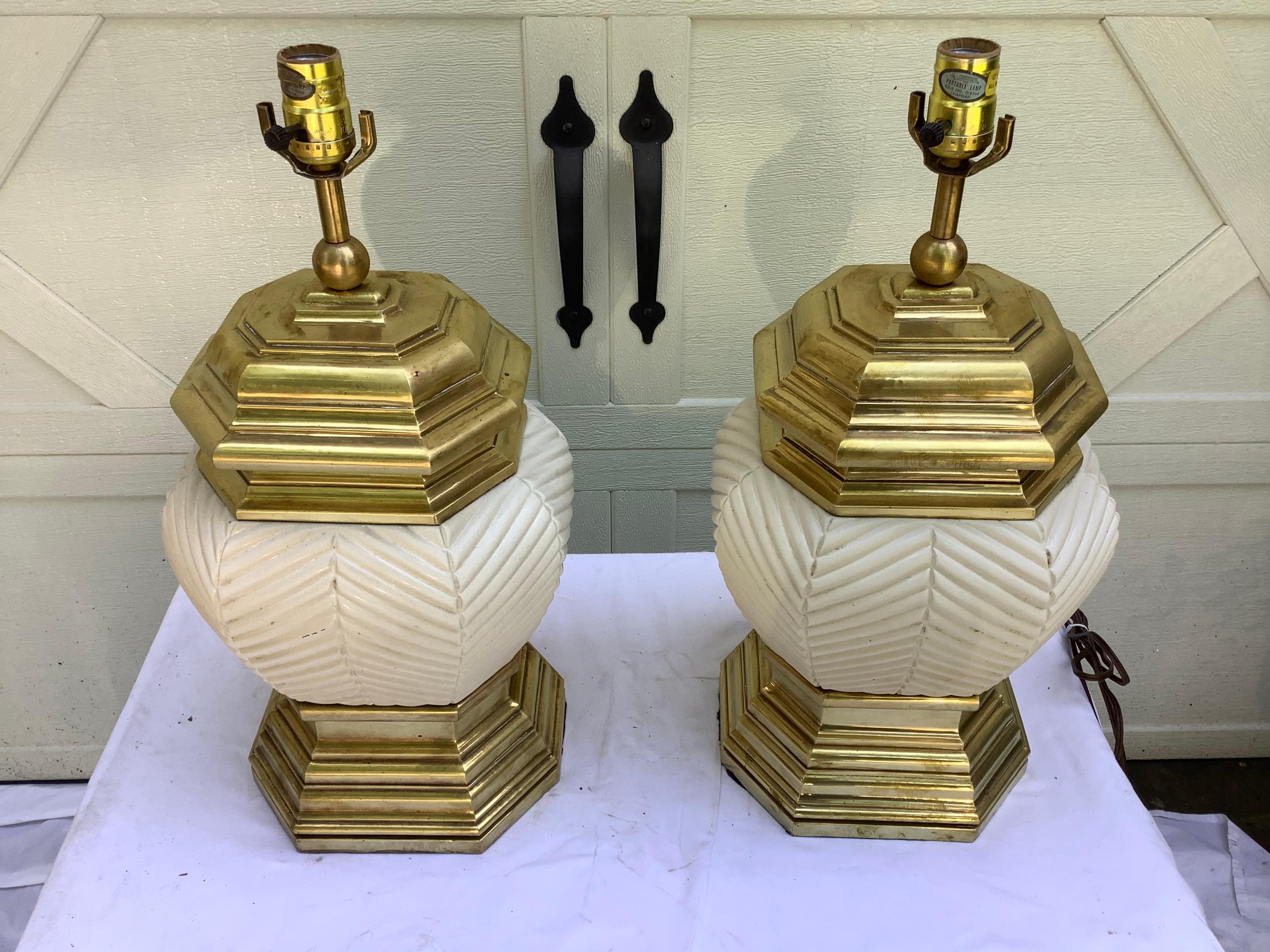 Hunky pair of 1970s brass and ceramic lamps by Chapman. ( one of my favorite lamp companies). The ceramic portion has a crosshatched bamboo effect., in a neutral beige. The brass has been cleaned, but unlacquered. 20 “ H to the top of the socket.